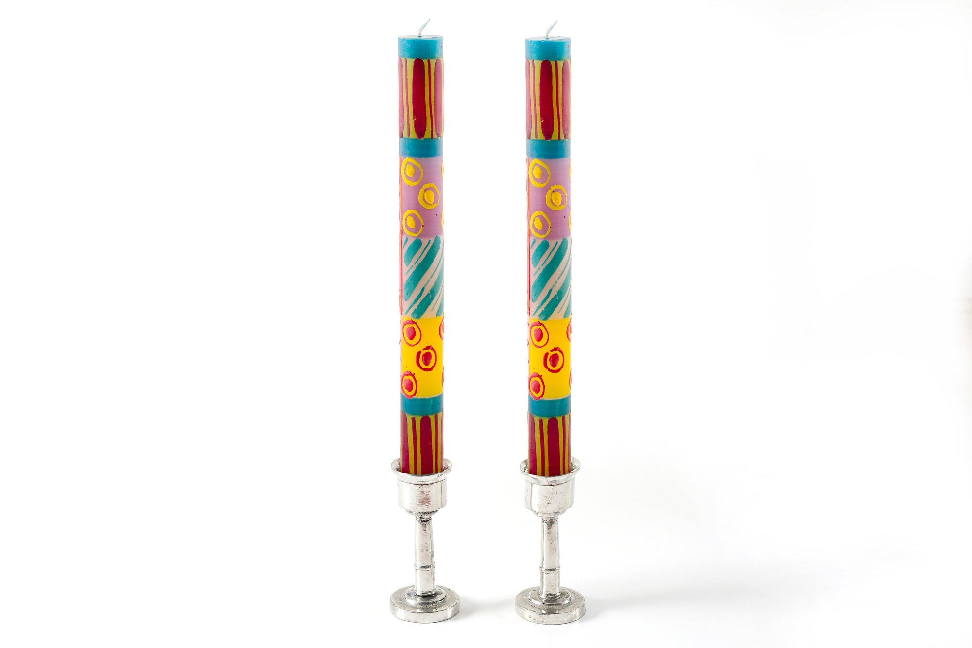 Matched taper pair of Carousel candles in pewter taper holders. Dots & stripes in pinks, yellow, turquoise, and greens!