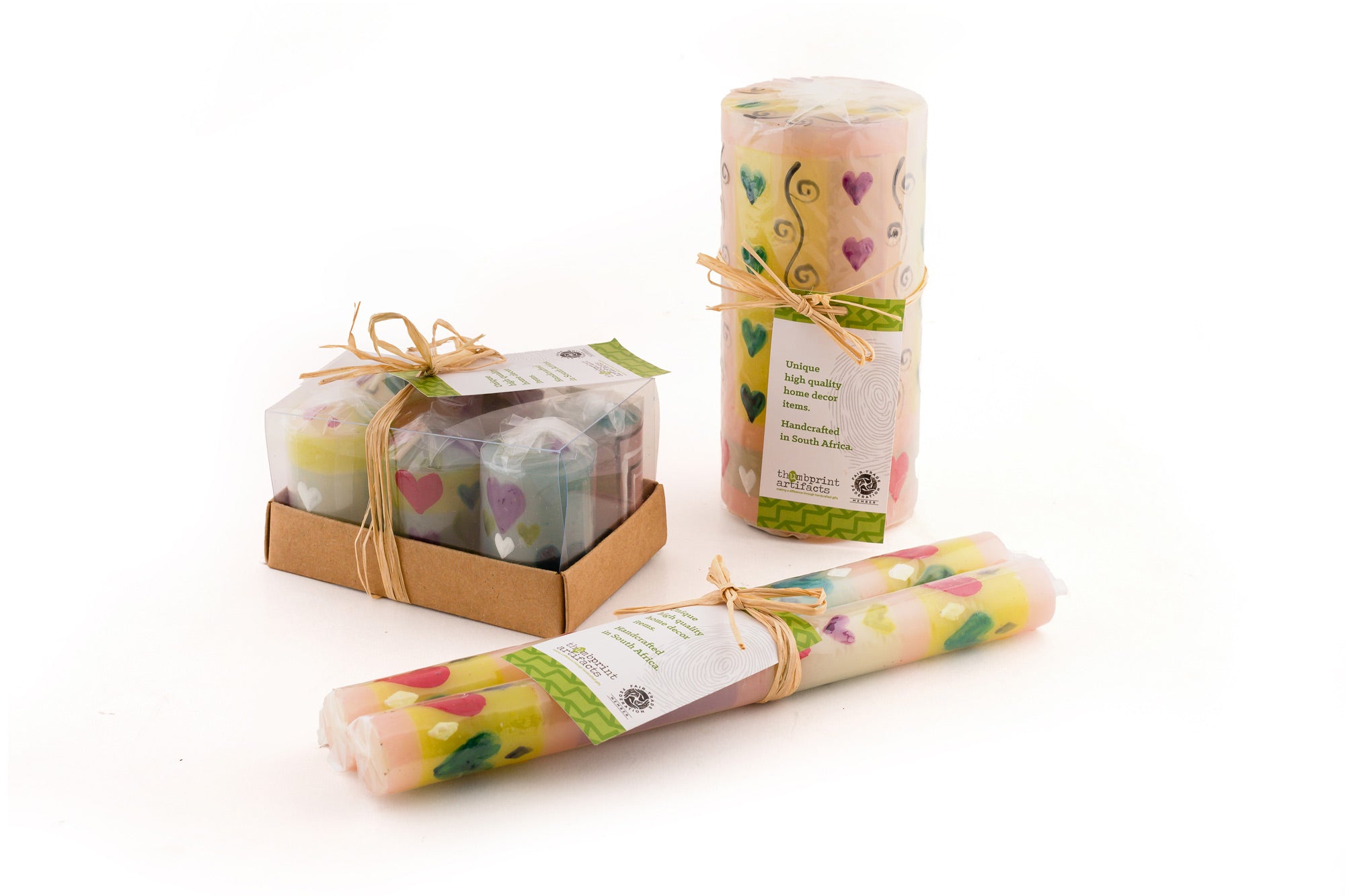 Packaging presentation of the various candles; votive 6-pack, 3x6 pillar and taper pair. Each candle is individually wrapped and come with a story card.