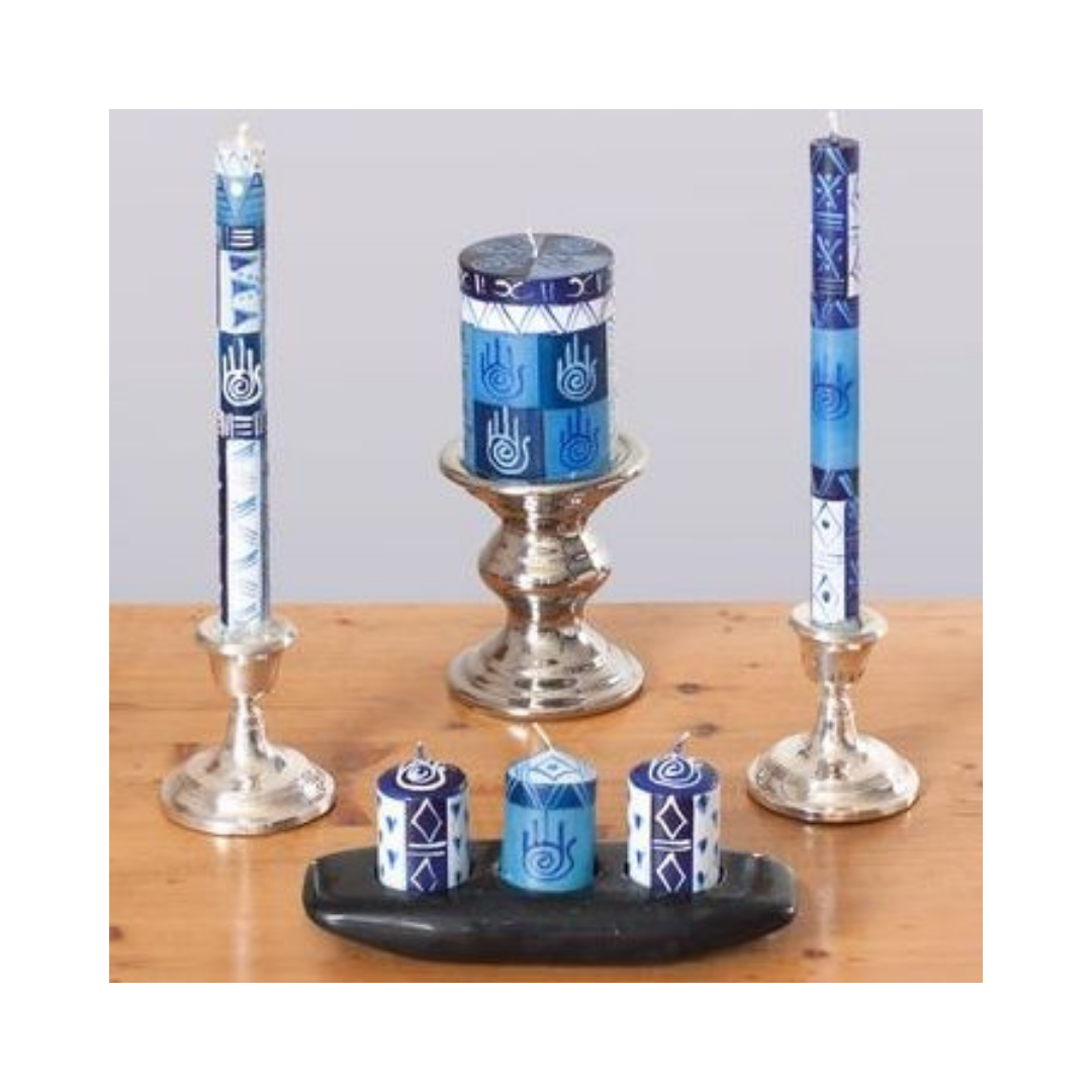Hamsa hand made and hand painted candles.  Taper candle pair in silver candle holder, 3x4inch pillar candle on silver candle stand, and three votives on a black votive holder.  Blue & white Hamsa design. Fair trade candles.