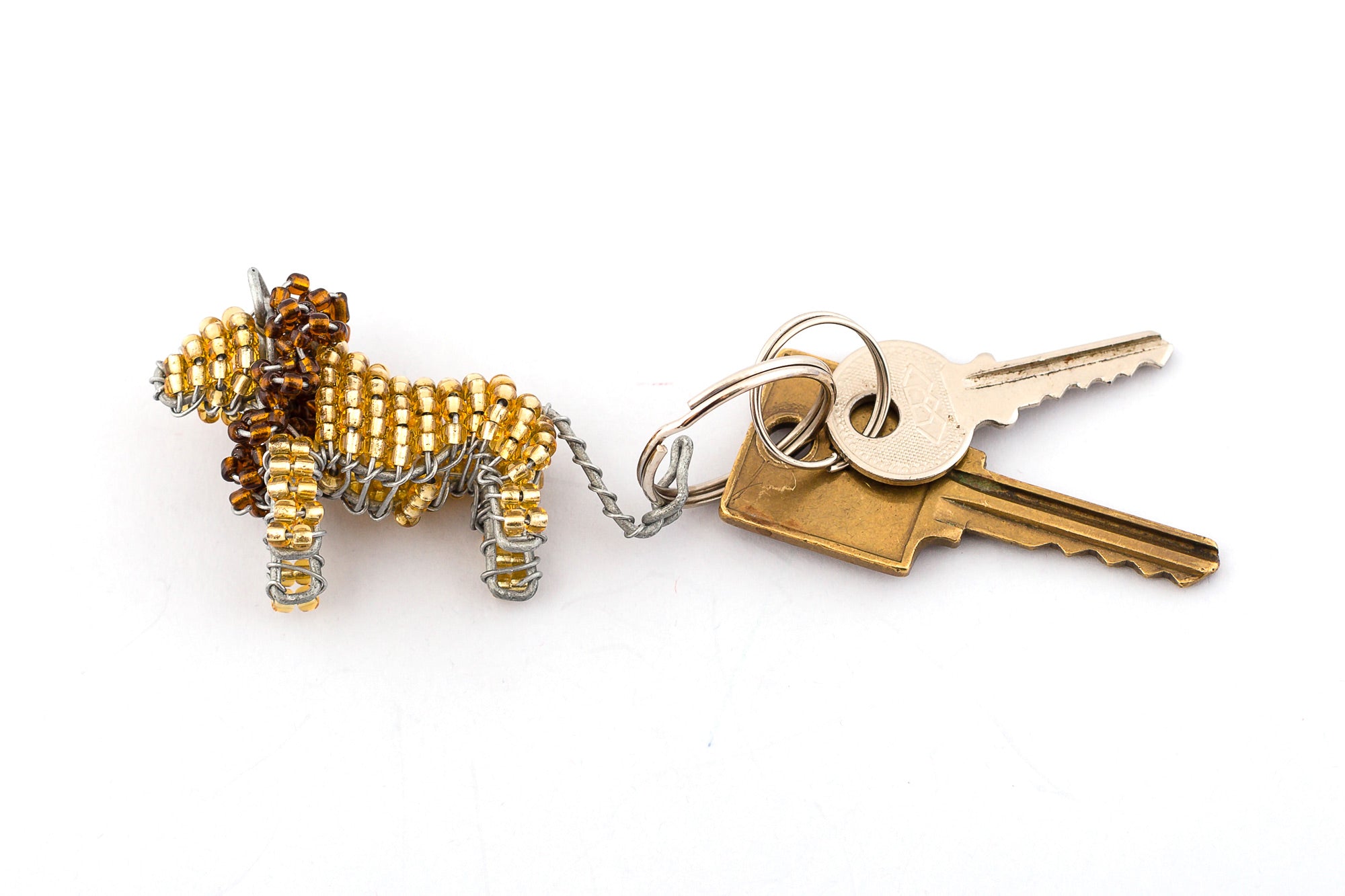 Beaded lion key chain. Handmade in golden beads with a dark brown mane.  Good protector of keys! Fair trade products.