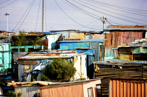 Shacks in South Africa that were the inspiration for the bird houses made from recycled tin pans.