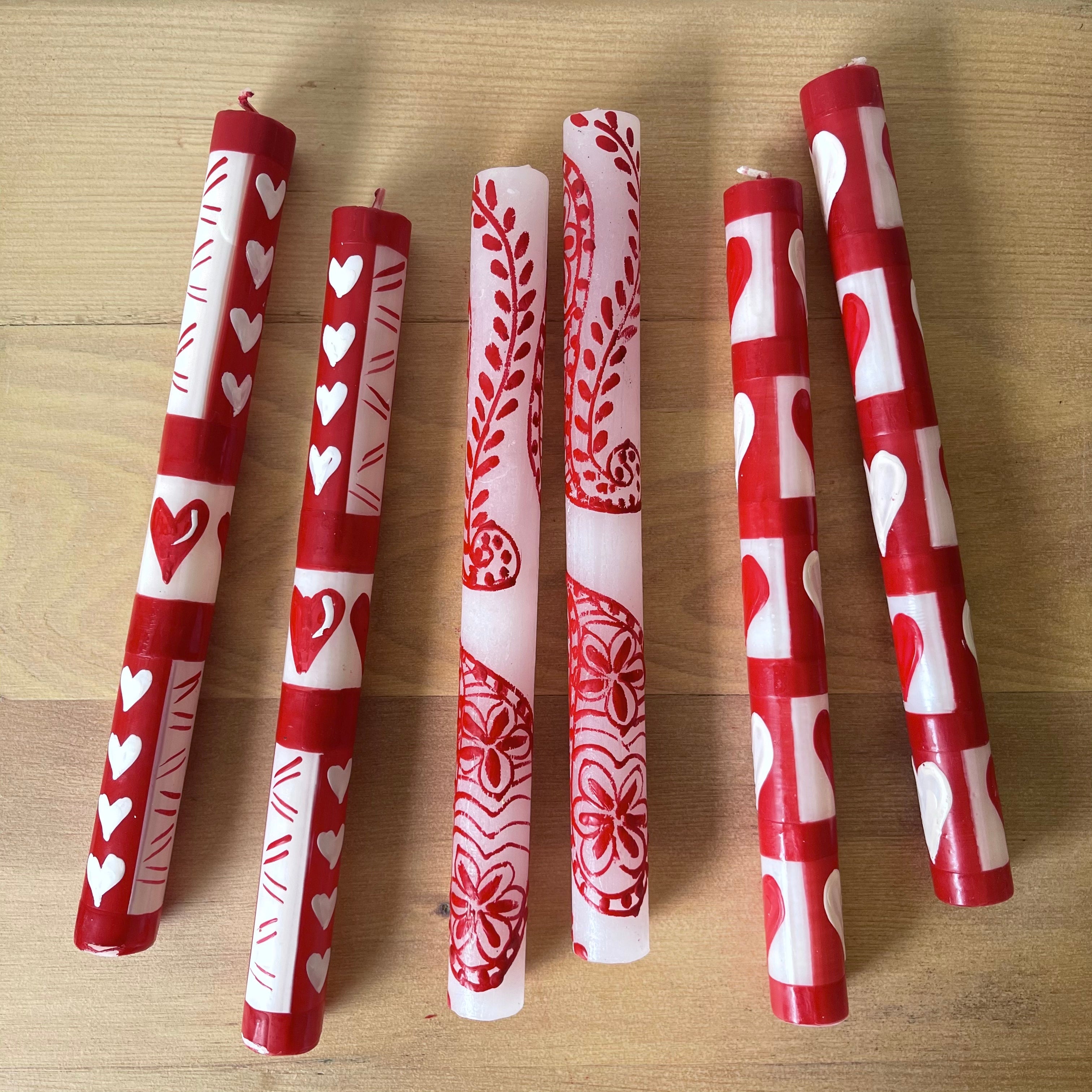 Two pairs of Valentines taper candles hand painted with red & white hearts together with a Henna Red on White taper pair, showing how fun it is to mix the different designs.