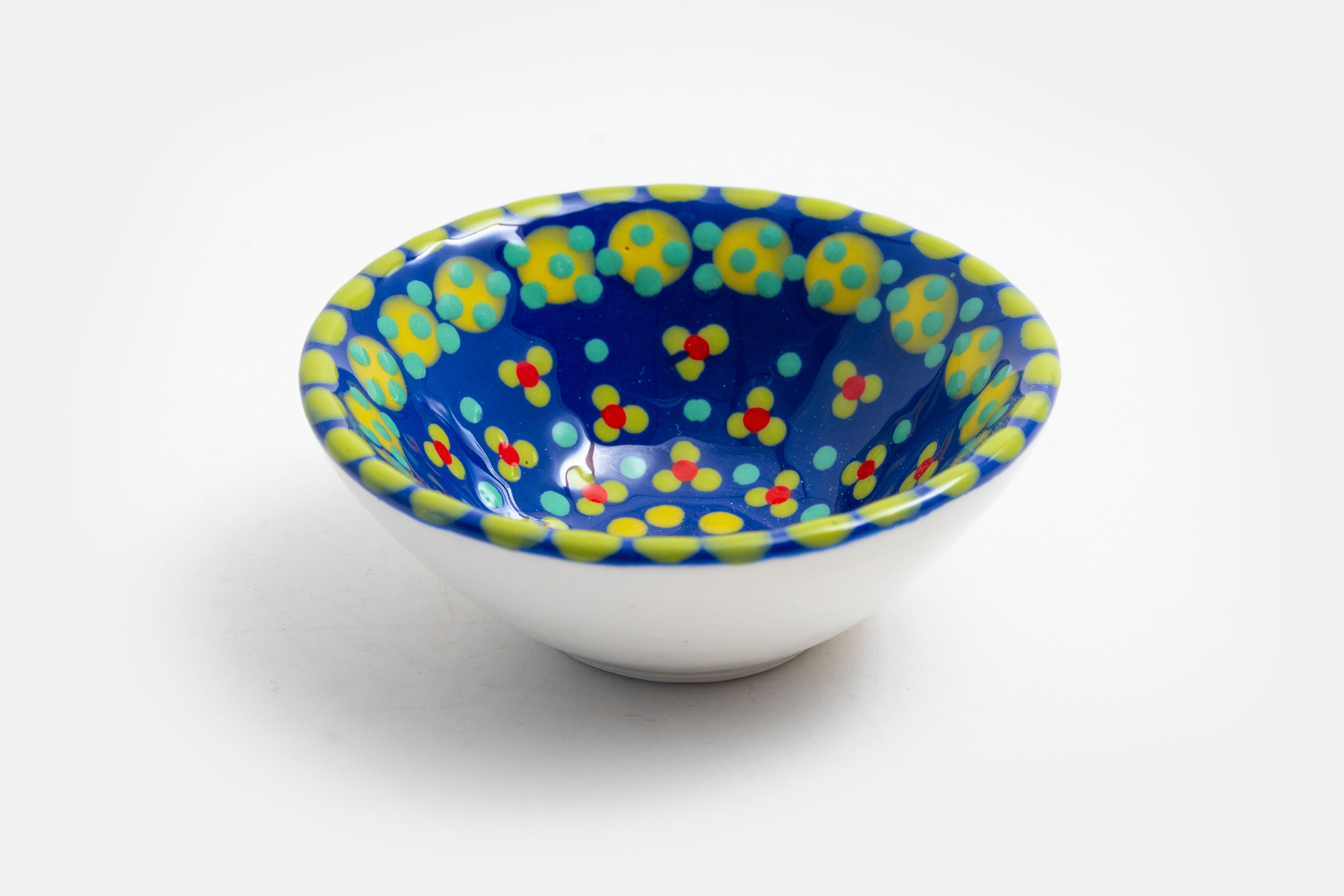 Tiny ceramic bowl, indigo blue background with mixed patterns of dots & stripes in different sizes and colors.  Microwave & Dishwasher 