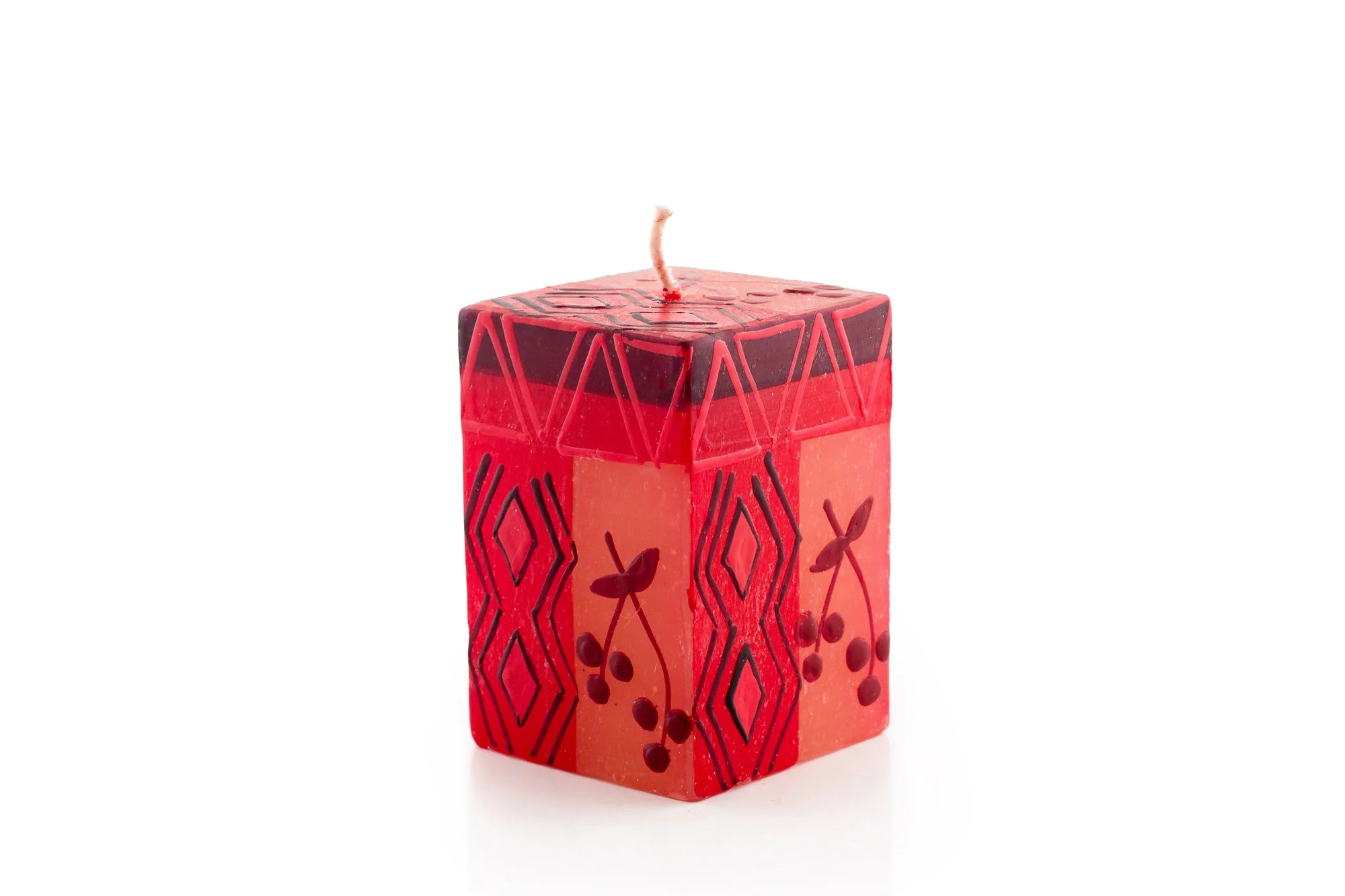 2" x 2" x 3" Berry Blaze cube candle. Bright red with darker berry design mixed with geometric design.
