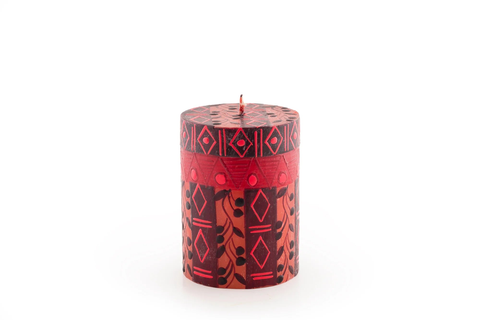 3" x 4" Berry Blaze pillar candle. Bright red with darker berry design mixed with geometric design.