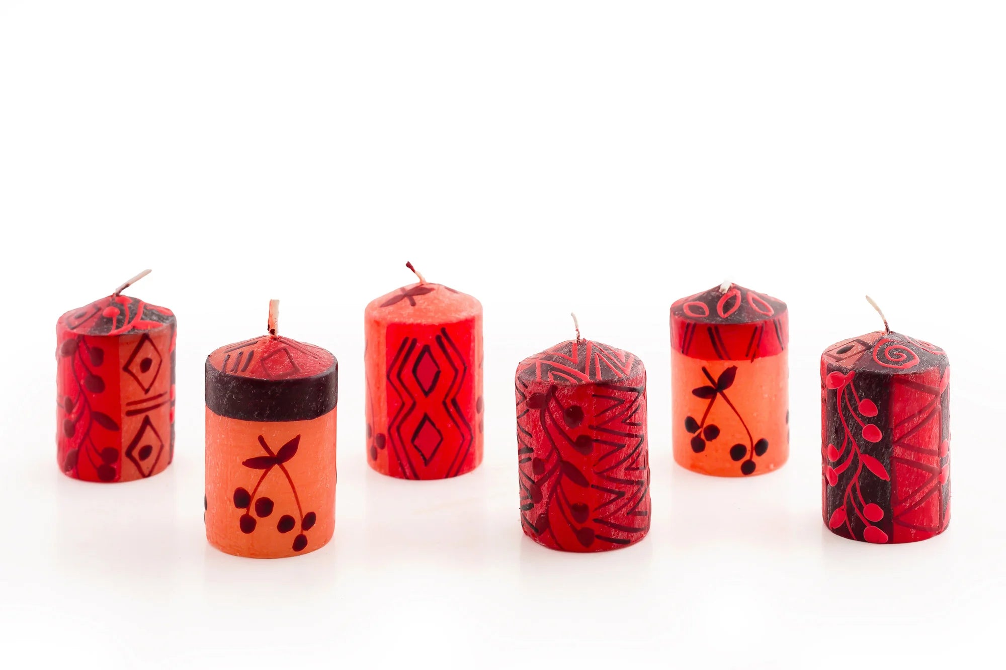 6/ 2" Berry Blaze votive candles. Bright red with darker berry design mixed with geometric design.