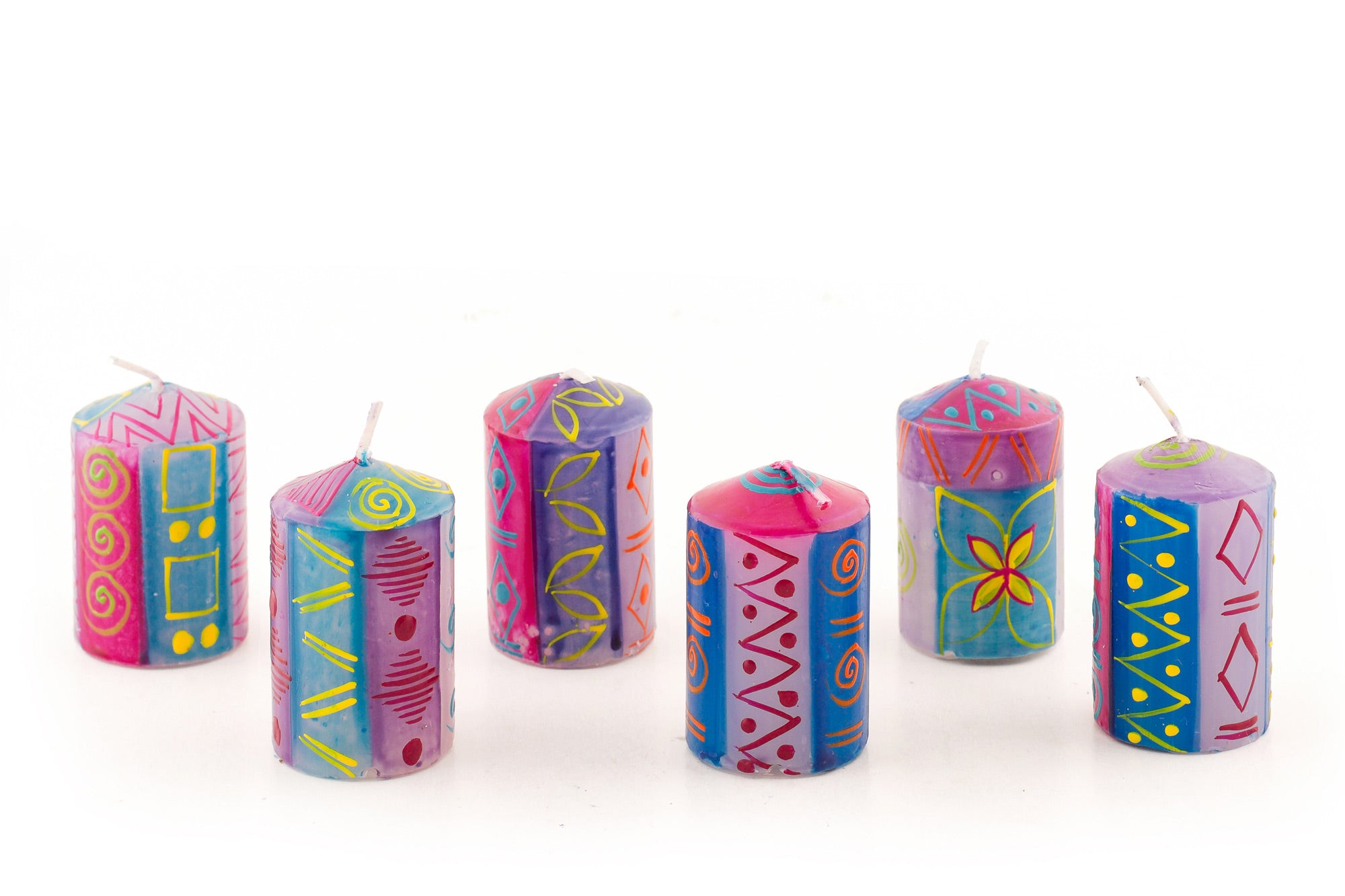 6 Blue Moon votives in various designs in turquoise, blue, fuchsia, with yellow, orange and red touches. 6 votives come in a gift pack.