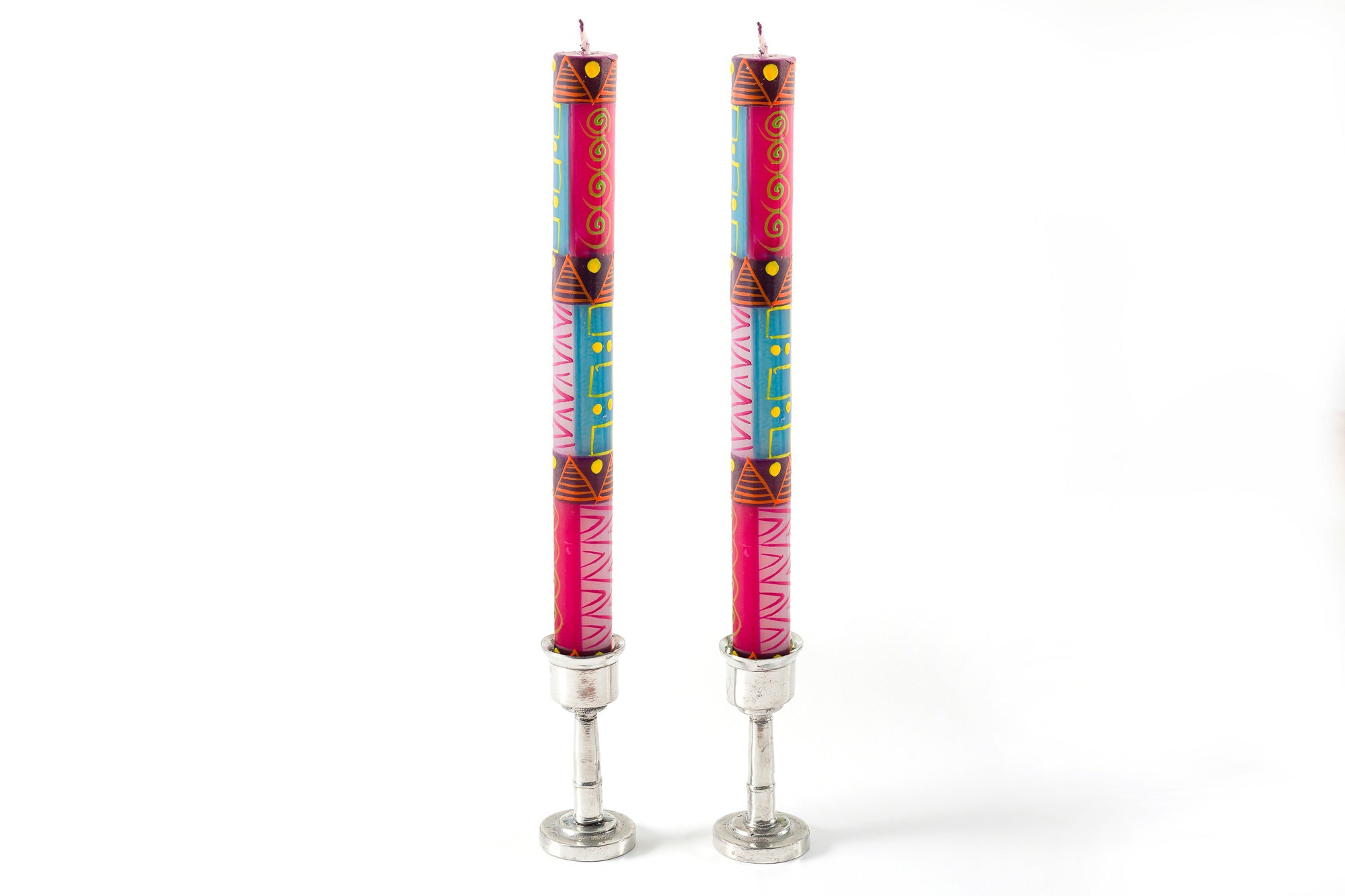 Blue moon candle pair in pewter candle taper holders. African type design in purple, pink, yellow and fuchsia.