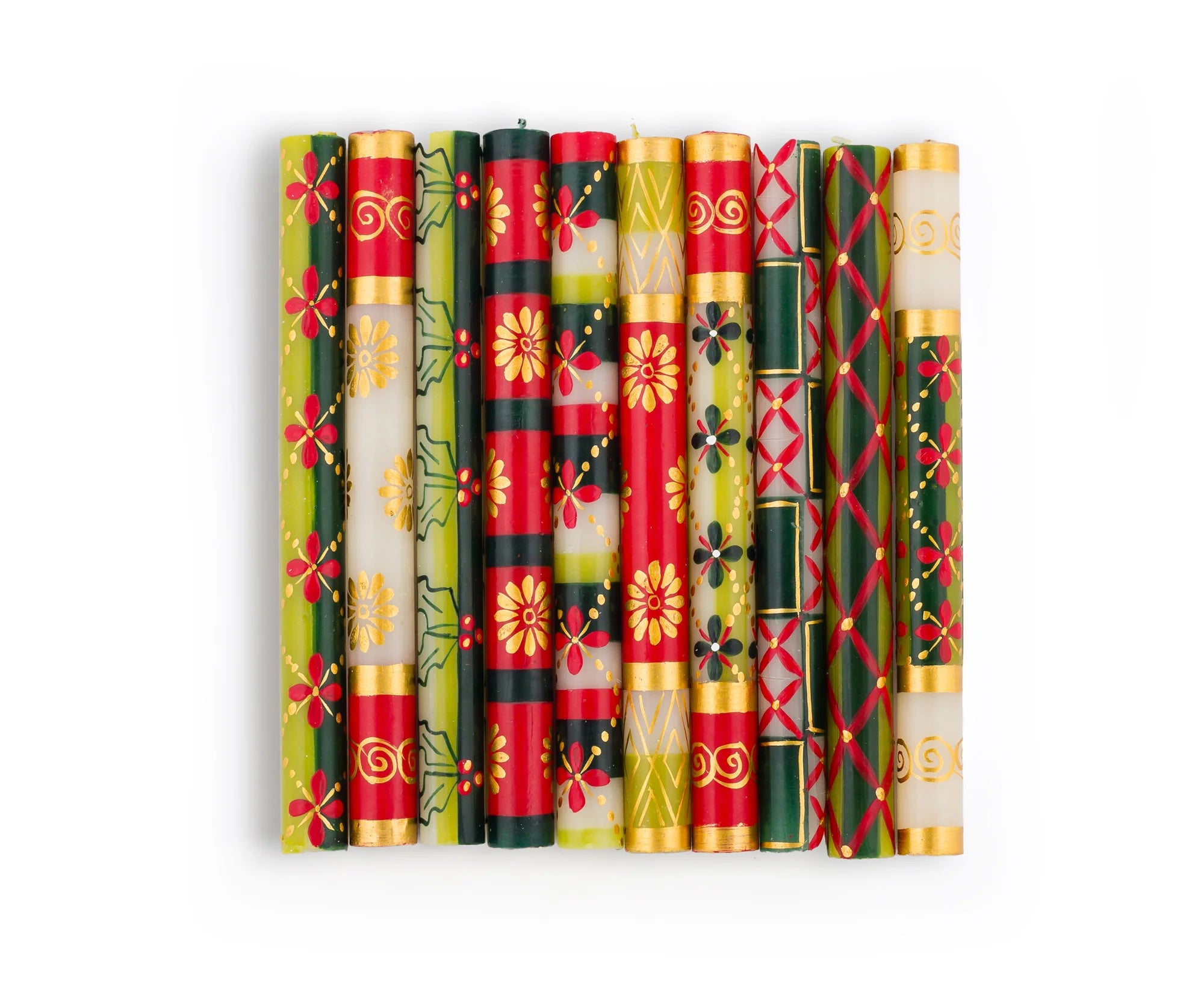 10 Christmas dinner tapers in the 10 designs of the Christmas collection. Hand painted in various traditional Christmas patterns in red, dark green, light green and gold on white tapers