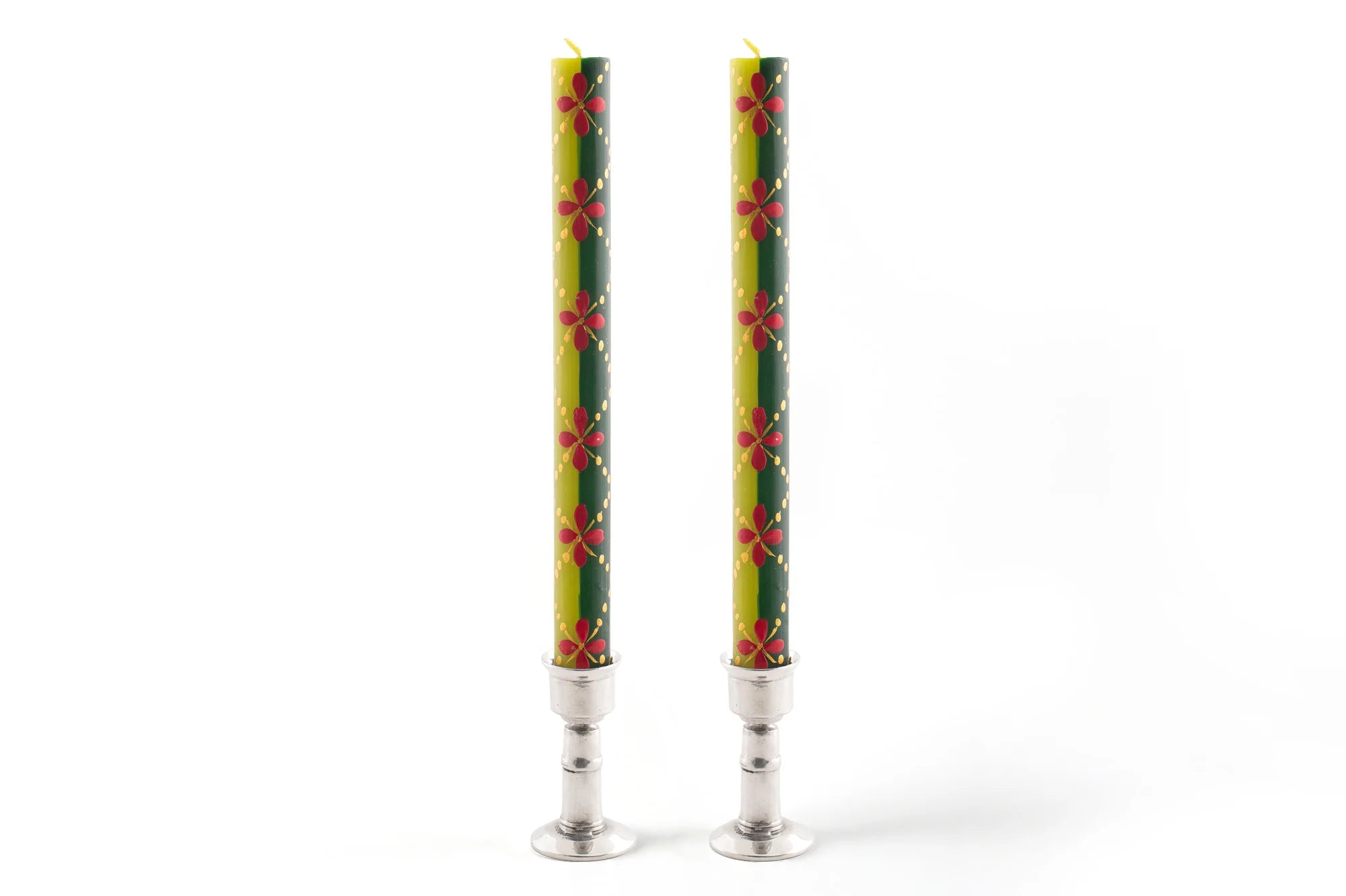 Matched pair of Christmas dinner tapers in pewter taper holders. Hand painted in various traditional Christmas patterns in red, dark green, light green and gold