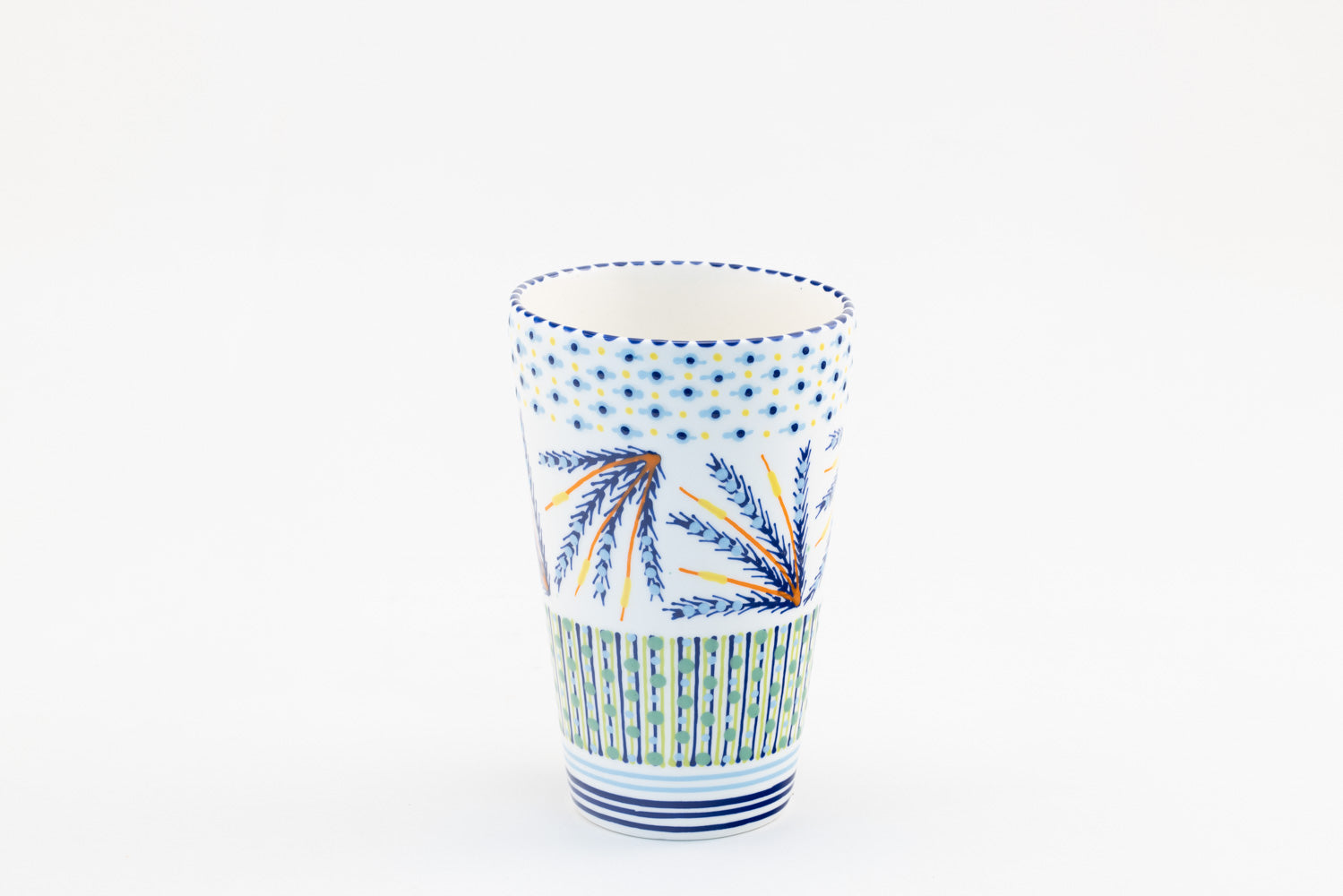 Ceramic vase with background color of white.  Dots, stripe and flowers make the colorful designs on the background colors. 8.8" tall x 5.5" wide.