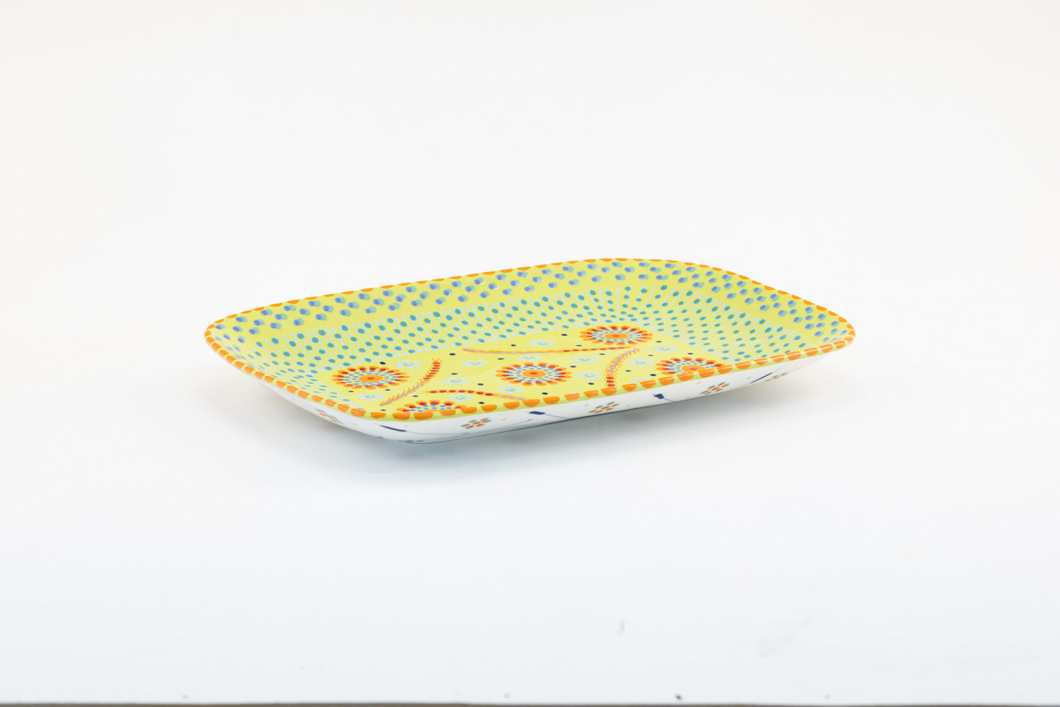 Colorful, ceramic and versatile serving platter. Microwave & dishwasher safe.  15" x 10".  Base color of lime green. Dots & Stripes and flowers are painted on top in red, yellow, indigo, and orange. Such an eye-catcher!