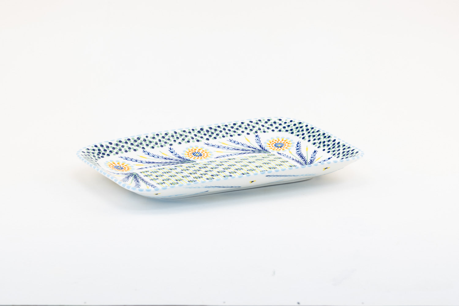 Colorful, ceramic and versatile serving platter. Microwave & dishwasher safe.  15" x 10".  Base color of  white. Dots & Stripes and flowers are painted on top in red, yellow, Lime Green, indigo and orange. Such an eye-catcher!