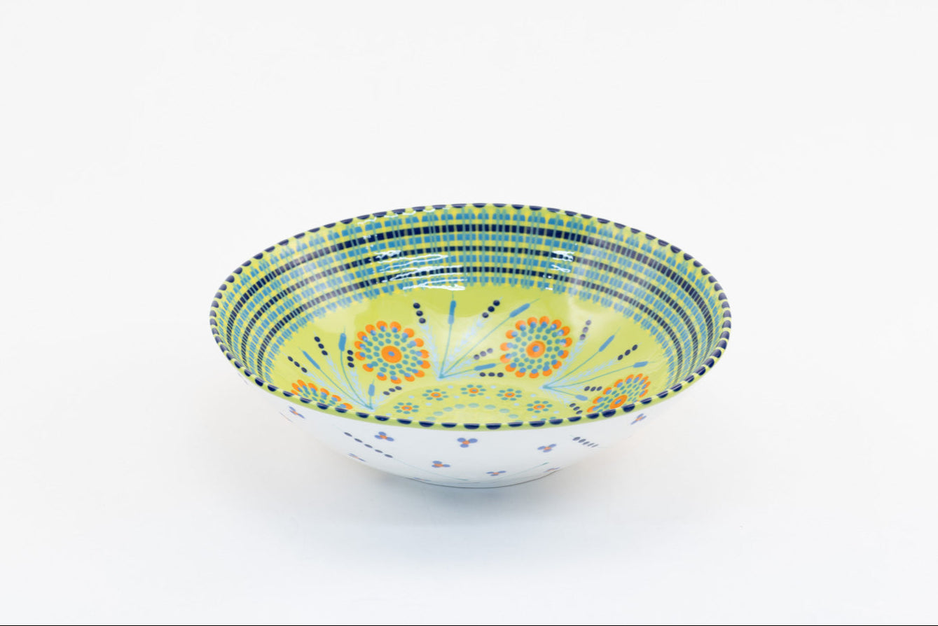 Lime green large round ceramic serving bowl. 11"x 3".  Lime background, painted with yellow, green, touches of red, and baby blue.  Microwave & Dishwasher safe.