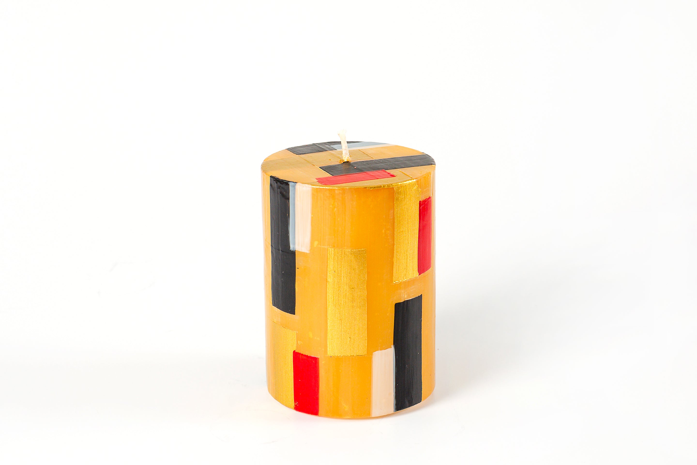 Klimt 3" x 4" Pillar Candle. Creamy gold base color candles with touches of black, gold along with hints of red.