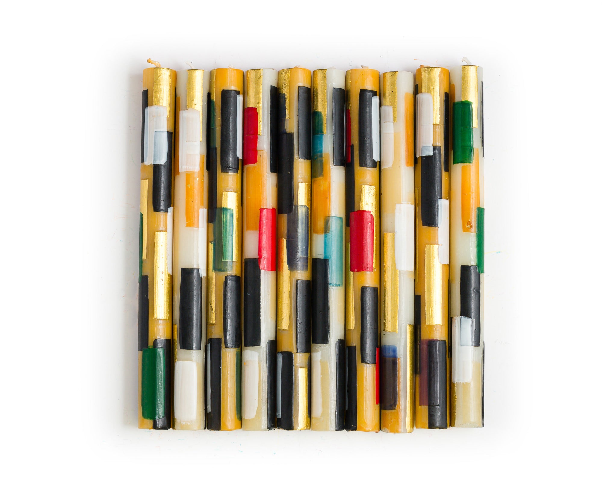 10 Klimt tapers one in each design of the collection. Cream & gold color tapers with rectangles of color; black, white, gold, consistent on all, then highlights of green, red, turquoise, dark blue, and forest green.