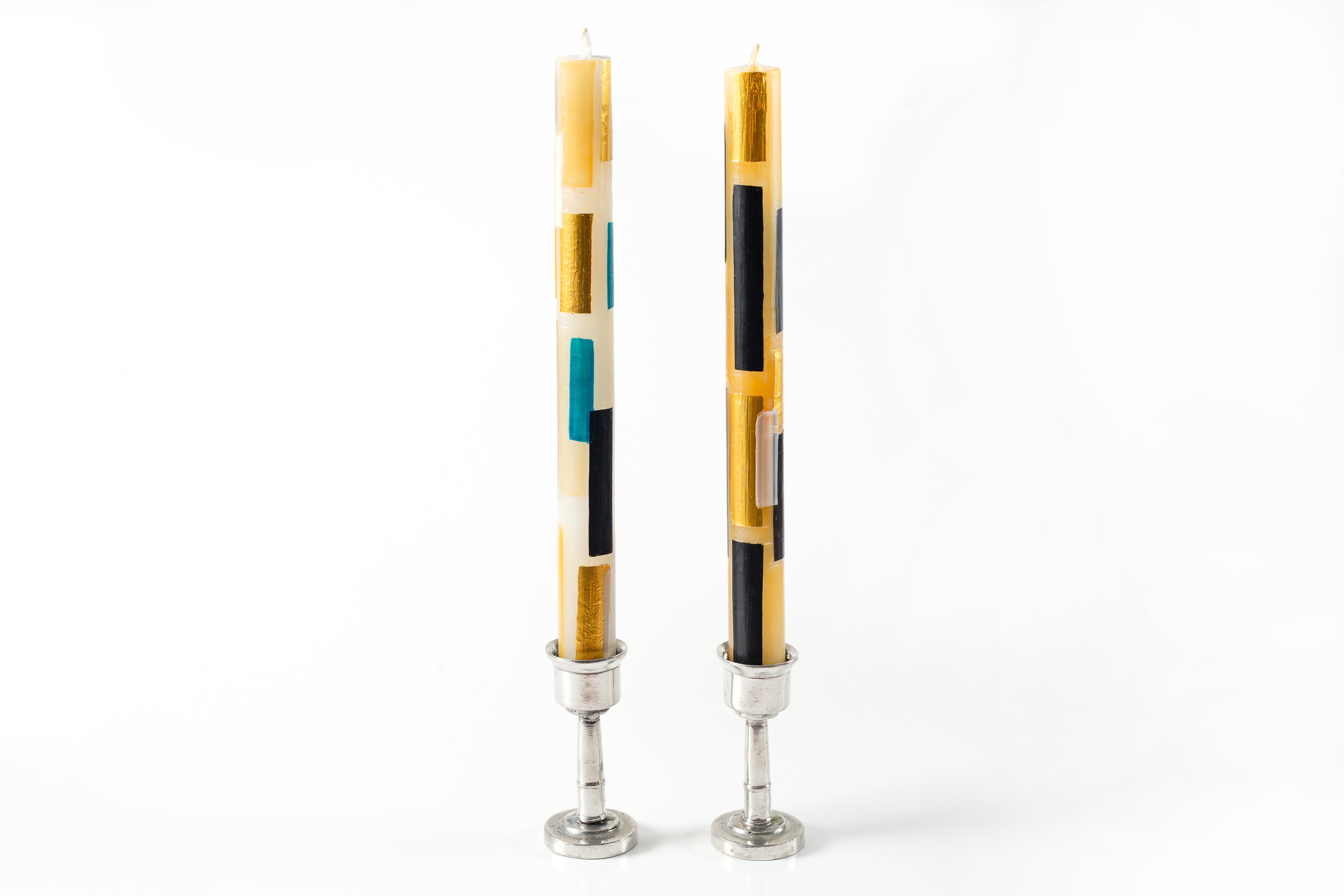 Klimt taper candle pair in pewter taper holders. Cream candles with touches of black, gold along with hints of turquoise make them a contemporary choice. Stunning!