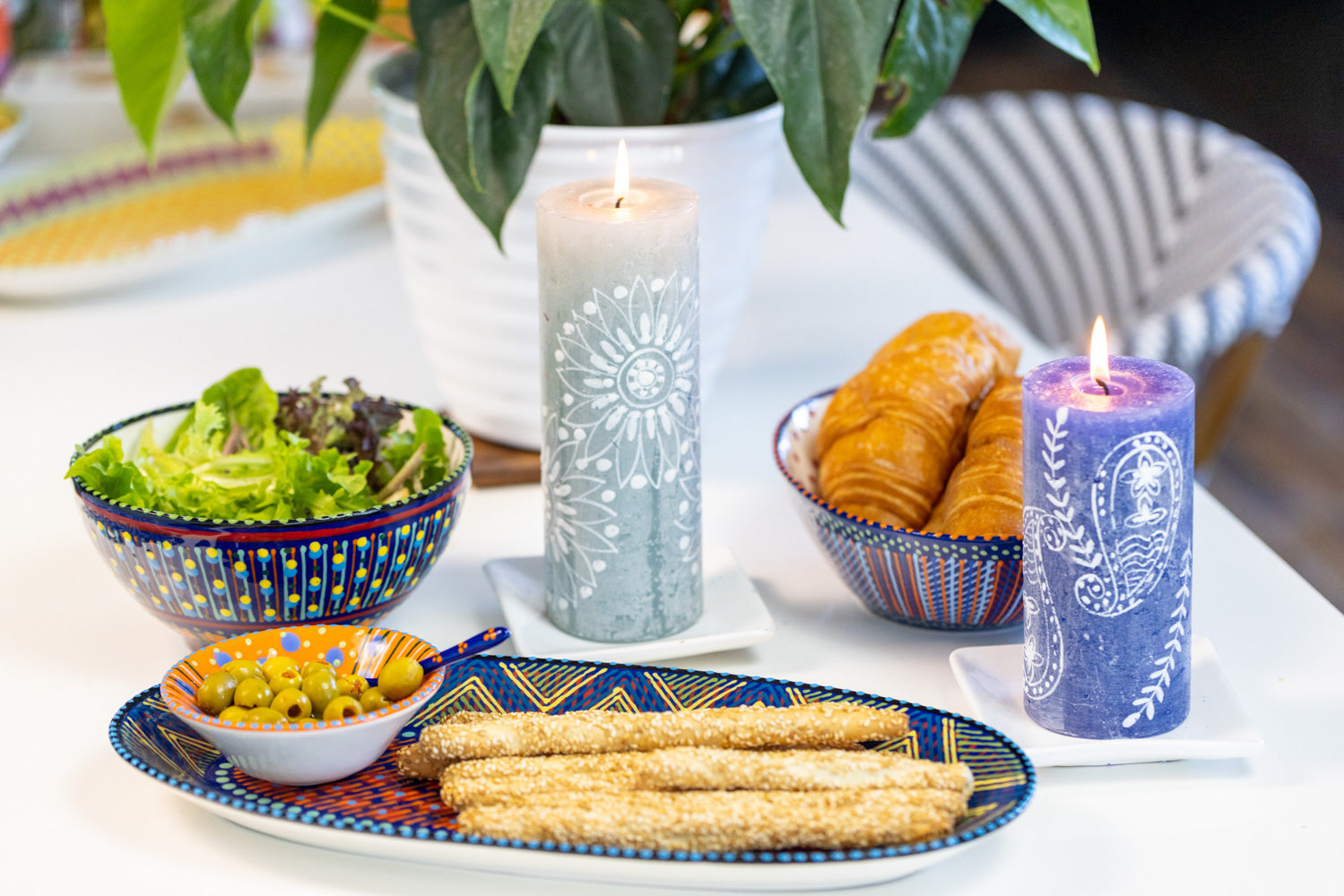 Photo of a table setting with the ceramics and Henna Pillar Candles. - great match! The mini nut bowl in used on the ceramic serving platter to show how well this size works to hold complementary items for the food on the platter.