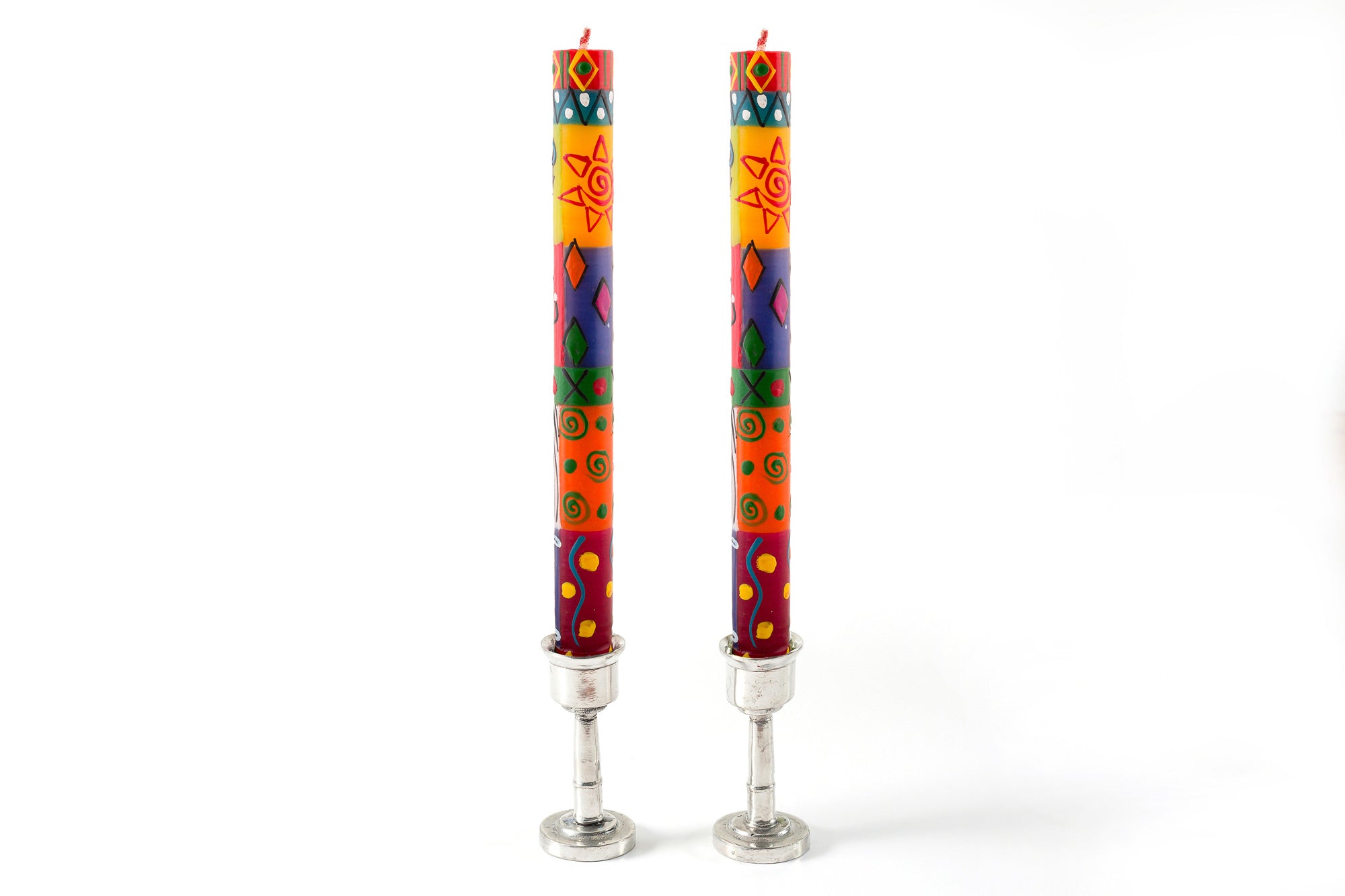Matched pair of Muticolor Ethnic tapers in pewter candle holders. Bright, colorful, sunshine and fun designs that sing out Africa!