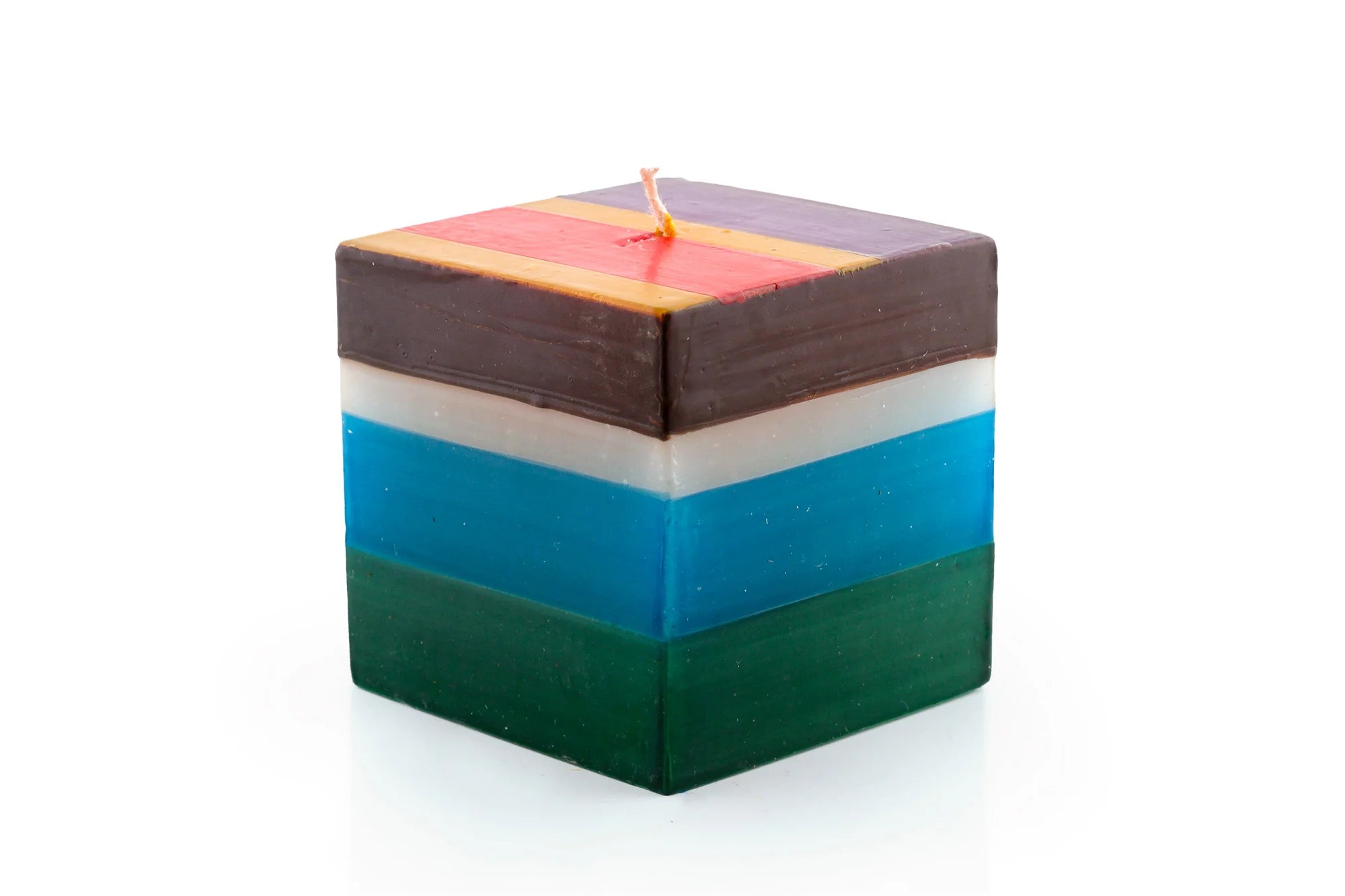 3" x 3" x 3" Memphis Stripe cube candle. Handmade and hand painted with stripes of assorted colors, turquoise, golden yellow, burnt orange, purple, dark green, brown & beige.