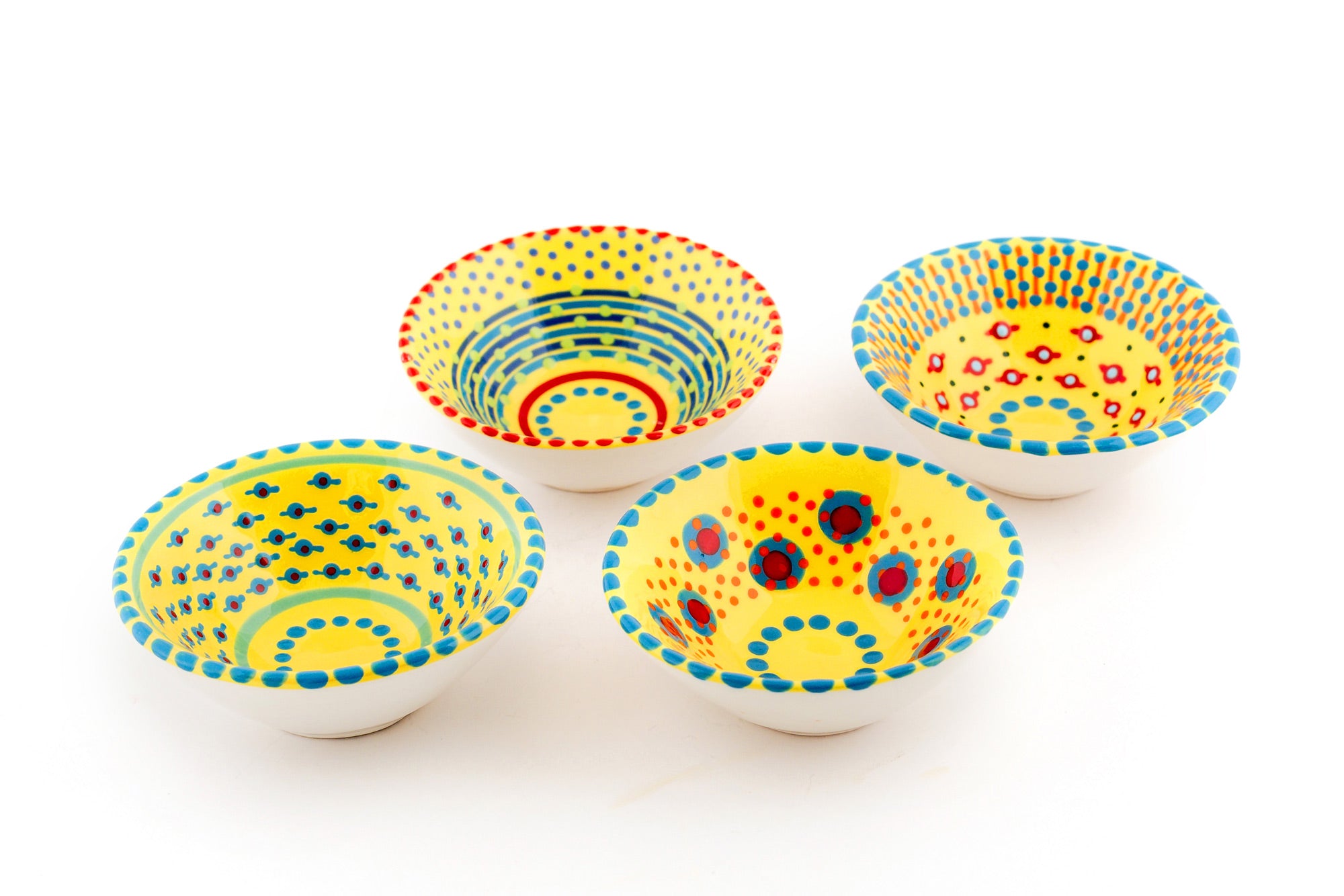 4 Yellow tiny bowls. Yellow base color with variations of the designs on the blue in read, orange, jasper green, baby blue and indigo.