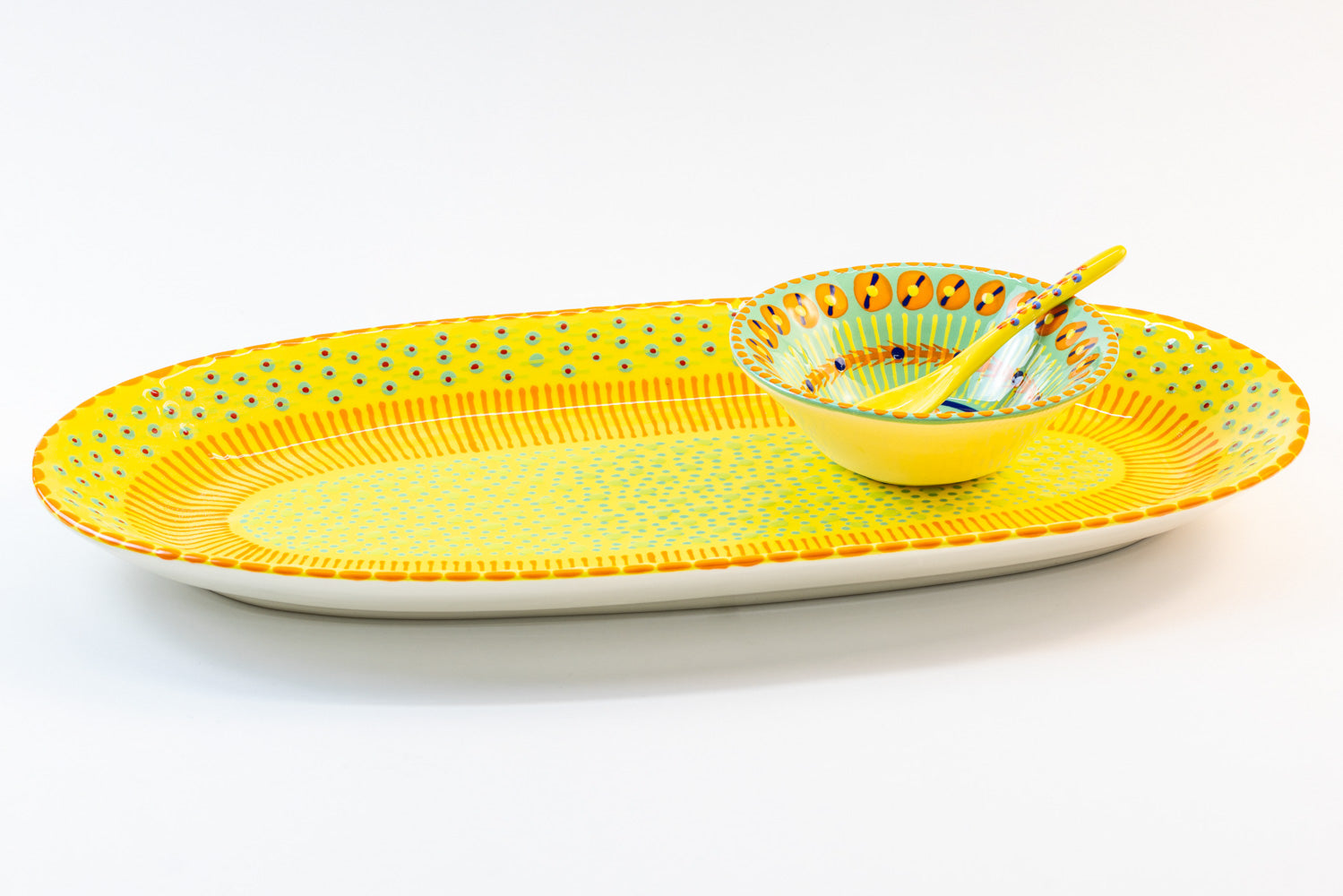 Ceramic serving platter in Yellow with Jasper Green mini nut bowl & Yellow small spoon sitting on the platter. Perfect size for condiments and wonderfully beautiful color contrasts.