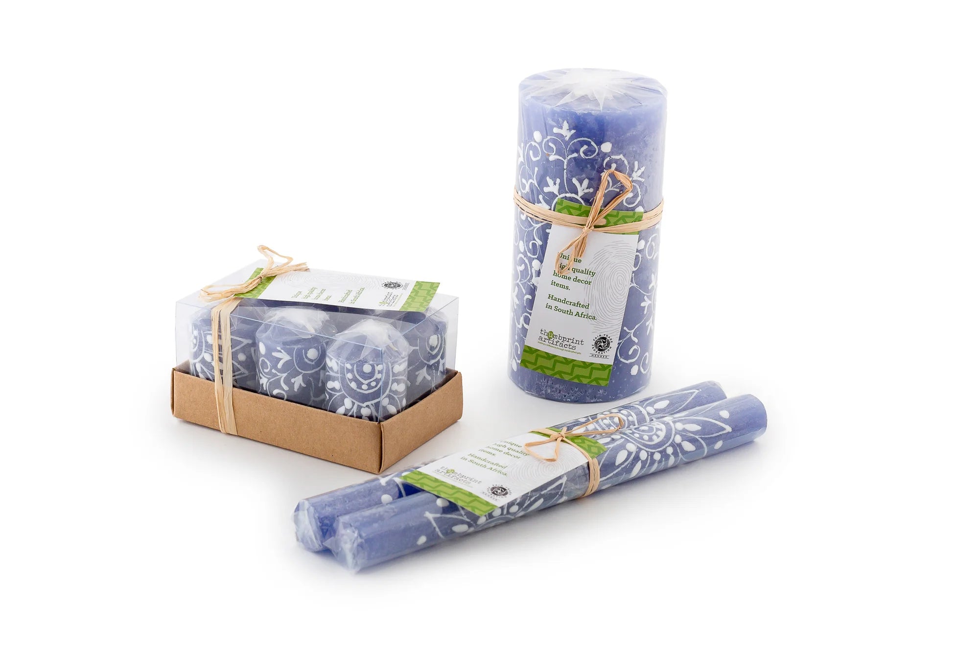 Photo shows the packaging; votive 6-pack tied with a story card, pillars & cubes are wrapped and tied with a story card, tapers are a matched pair, each wrapped  and tied together with a story card.