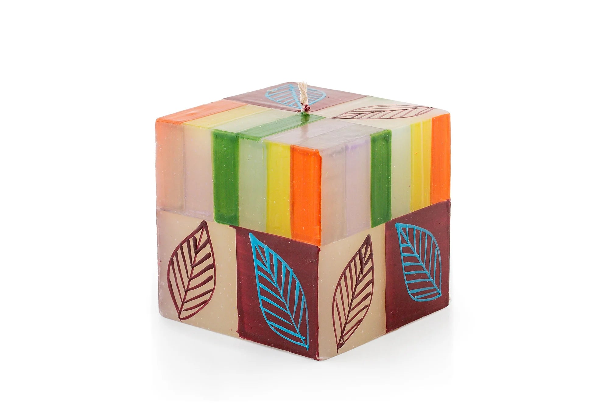 Magic Garden 3" x 3"x 3" cube candle. The cube is a white base with green, orange, turquoise, and lavender stripes. Overlay of pigment colors with a variety floral and leaf designs.