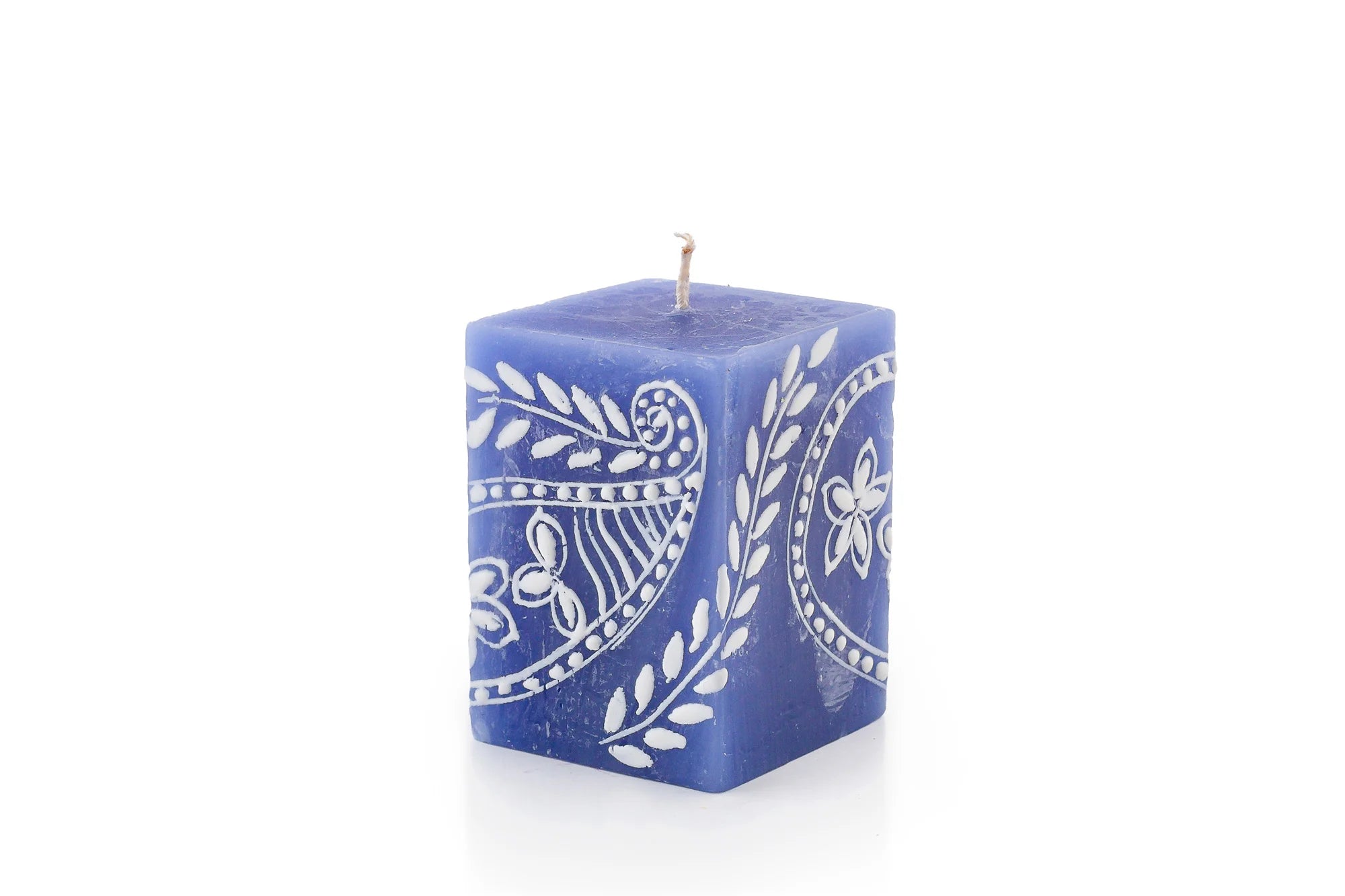 Henna white on blue 2" x 2" x 3" cube candle.   Henna designs painted in white on blue candles.  