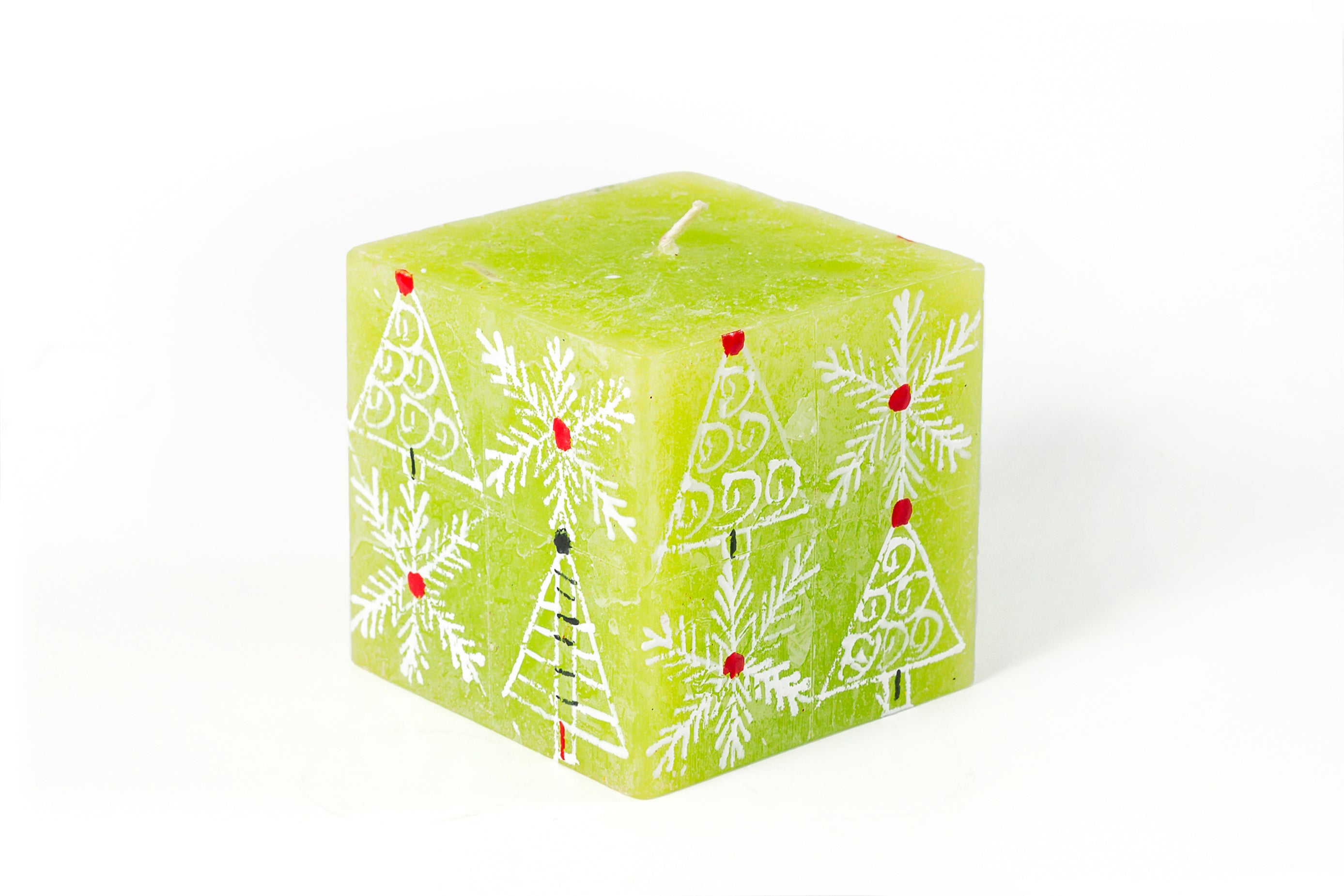 Whimsy Christmas 3" x 3" x 3" Cube Candle. This one has a green base color and hand painted with trees, snow flakes and Christmas ornaments in white with red, green highlights.