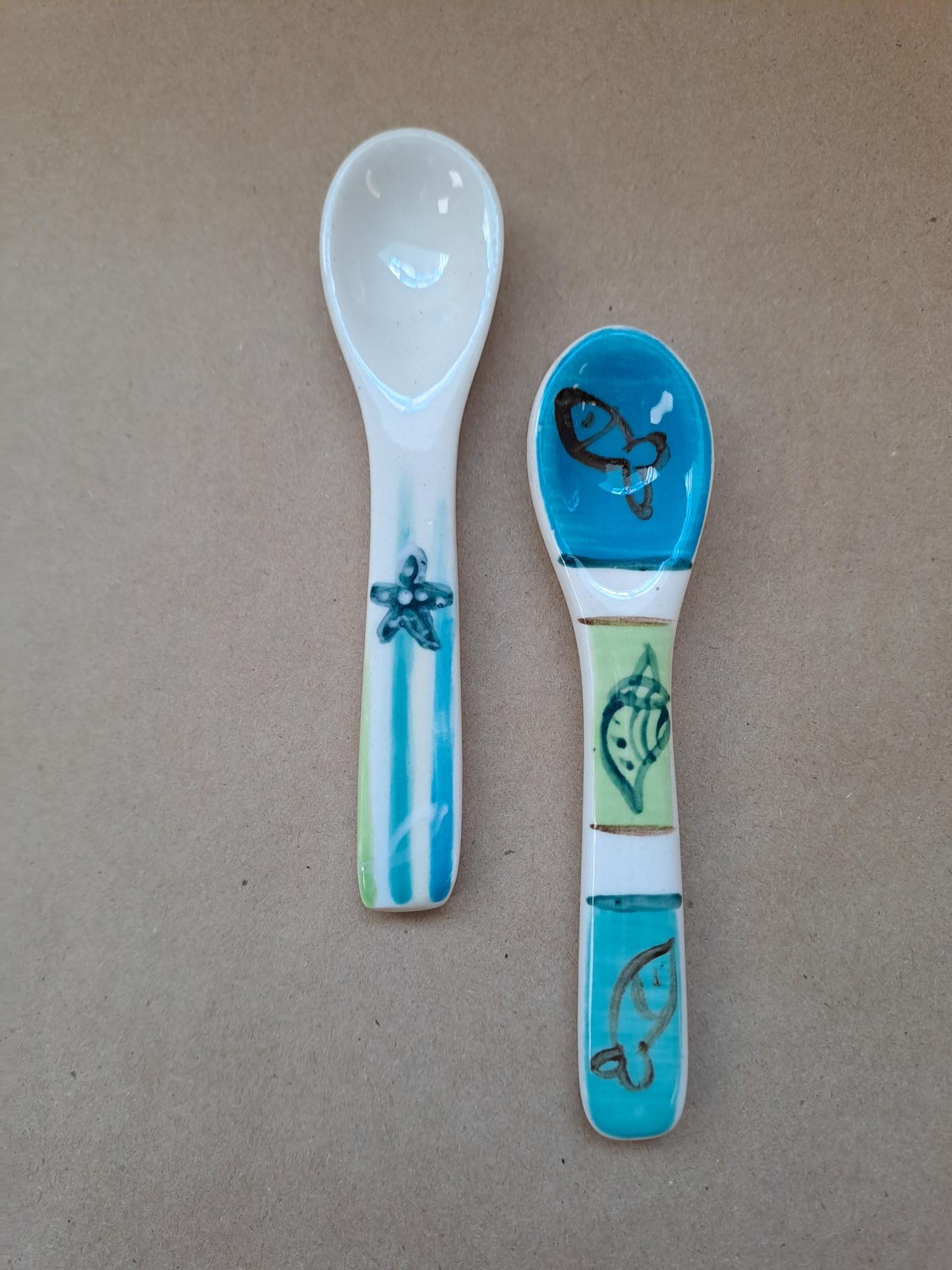 Arniston hand made and hand painted small spoon.  Fun seaside design with fish and seashells!
