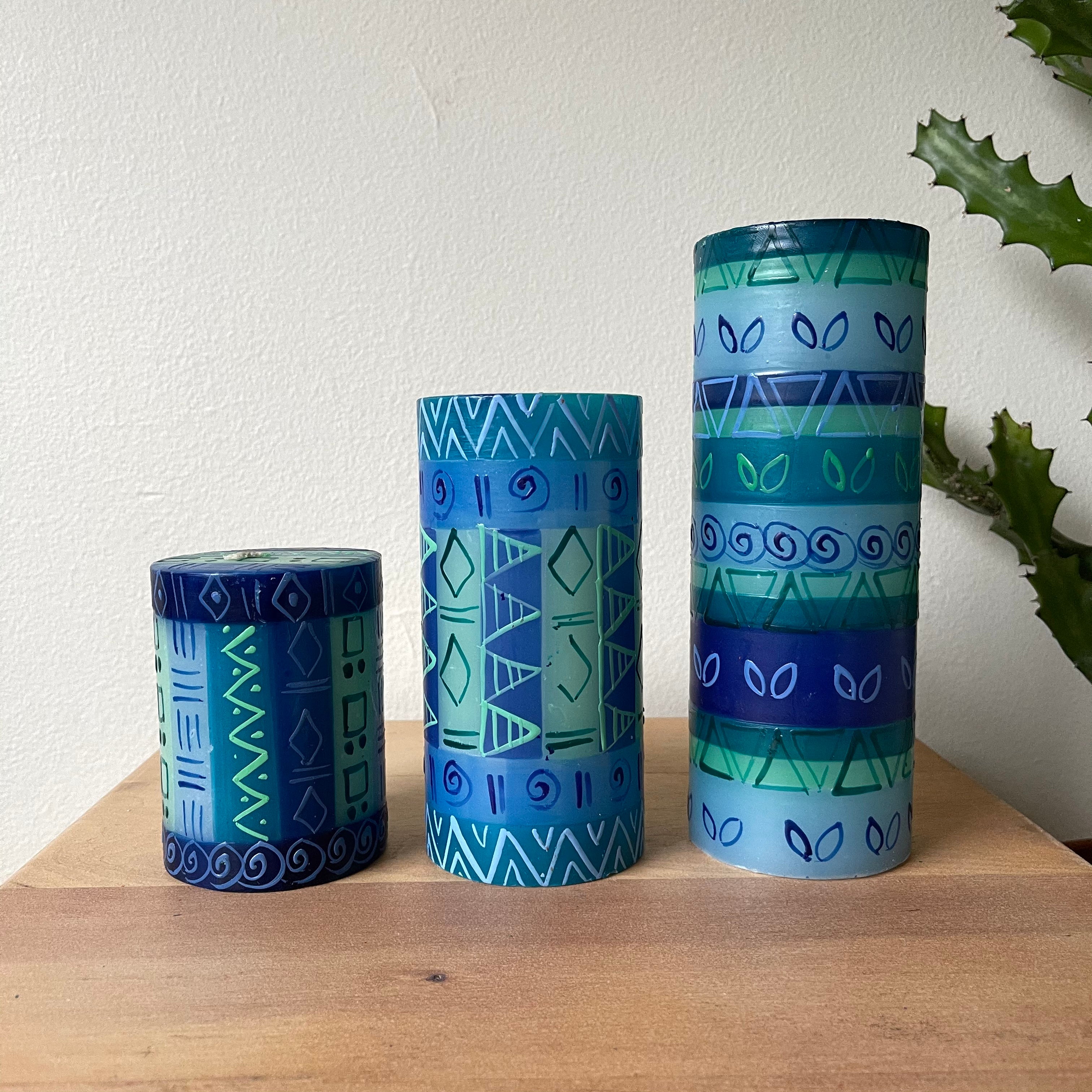 Three Blue & Green pillar candles.  3" x 4", 3" x 6", and 3" x 8".  Painted in a Blue & Green design. x 