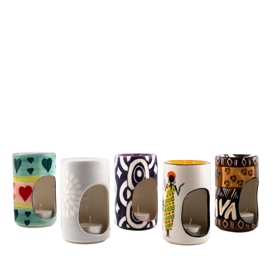 Ceramic hand made burners for room scents & tea lights.  Selection includes Pastel Hearts, Grey & white flower, Blue Batik, African Ladies, and Animal Print.  Collect them all - one for each room!