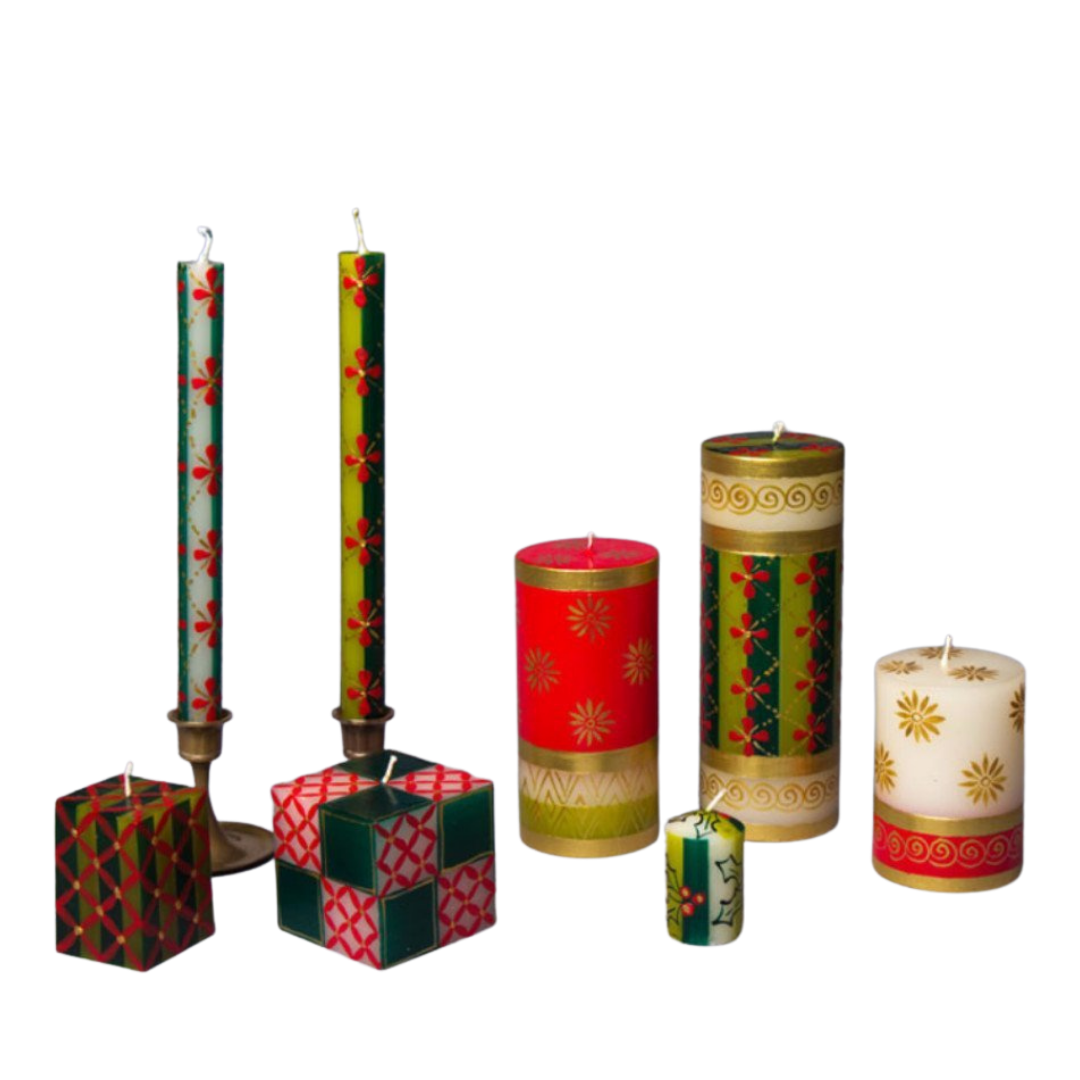 Christmas collection of hand made and hand painted candles.  Two cube candles, taper candle pairs, three pillar candles, and a votive candle.  Hand painted in various traditional Christmas designs. Fair Trade candles.