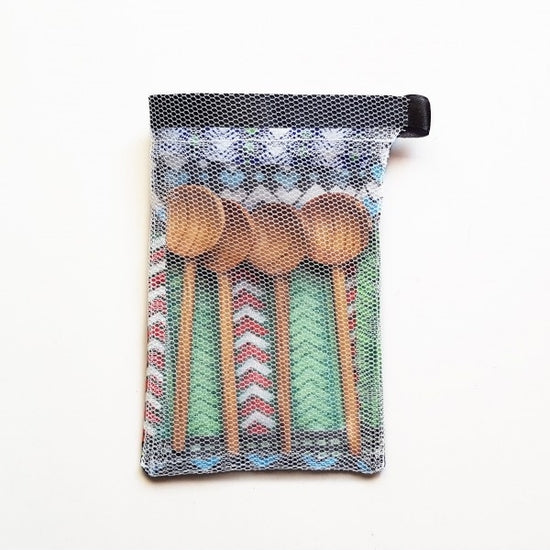 4 wooden coffee spoons presented in a small handmade pouch for gifting. Fair Trade product.