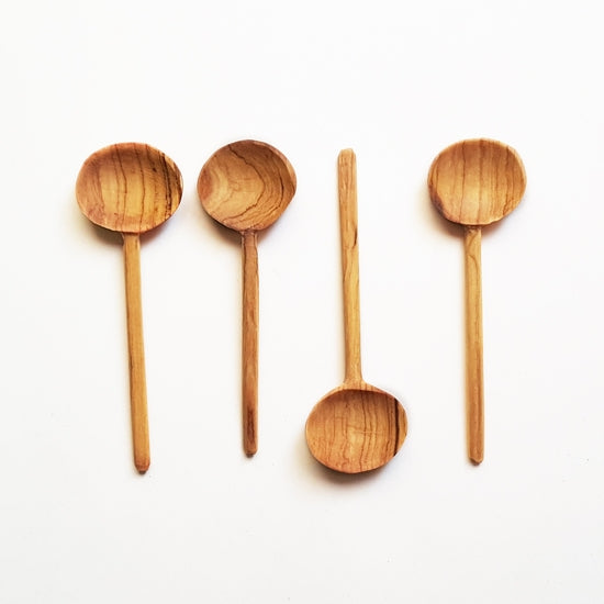 4 wooden spoons with round heads approximately 4" long. Fair trade product.