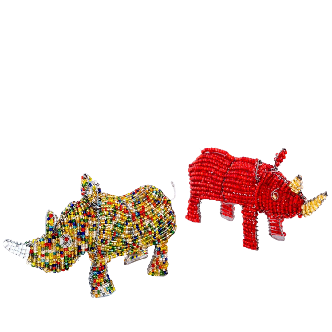 African Animals hand made beaded Rhinos; one in multicolor and one red with a yellow horn! Fair trade products.