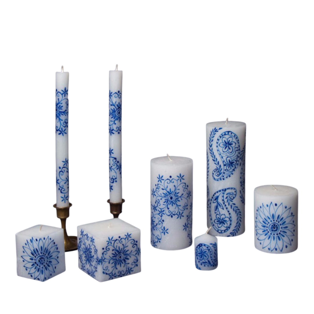 Henna Blue on White Hand made Candle Collection.  Cube candles, taper candles, pillar candles, and votives, all with blue henna design on white candles.  Fair Trade.