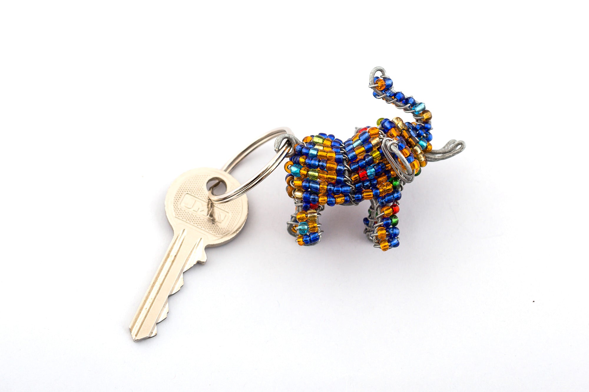 Beaded elephant key chain. Handmade in blue & golden beads - with trunk up for good luck! Fair trade product.