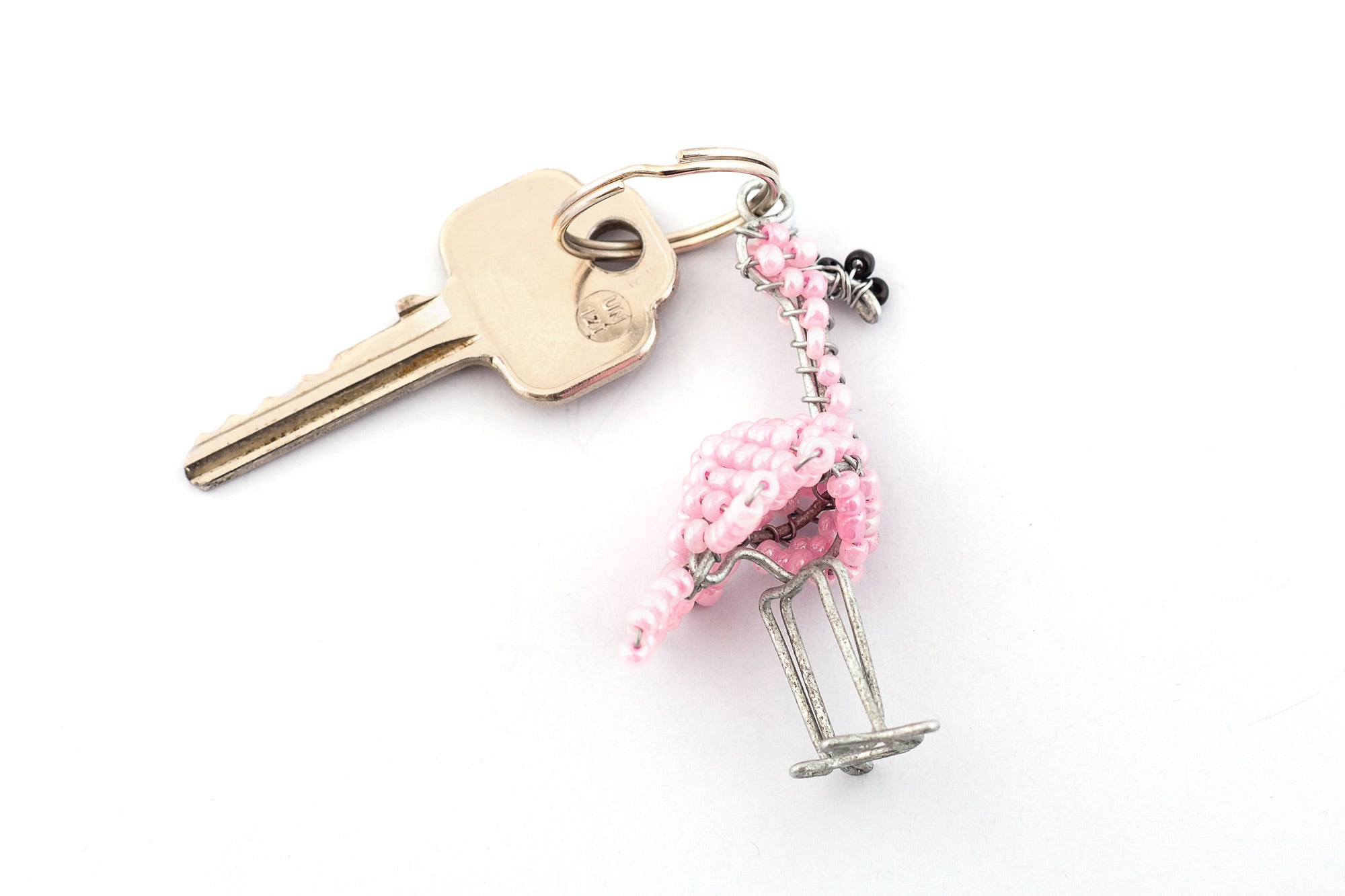 Beaded Pink Flamingo key chain.  Handmade with a beaded pink body and a black beak!  Fair trade products.