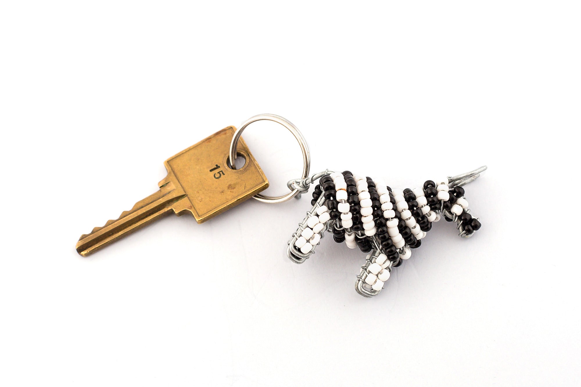 Beaded zebra key chain. Handmade in white and black stripes.  Fair trade gifts.