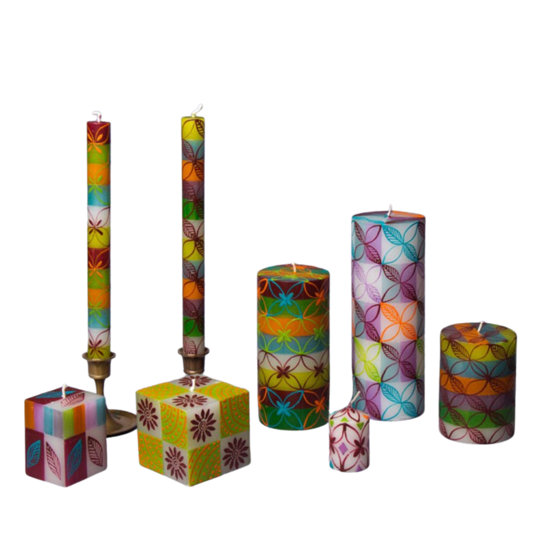 Magic Garden hand made and hand painted candle collection.  Cube candles, taper candles, pillar candles and votives, painted with foral designs, in green, maroon, turquoise, orange and purple on white candles.  Fair Trade home decor.
