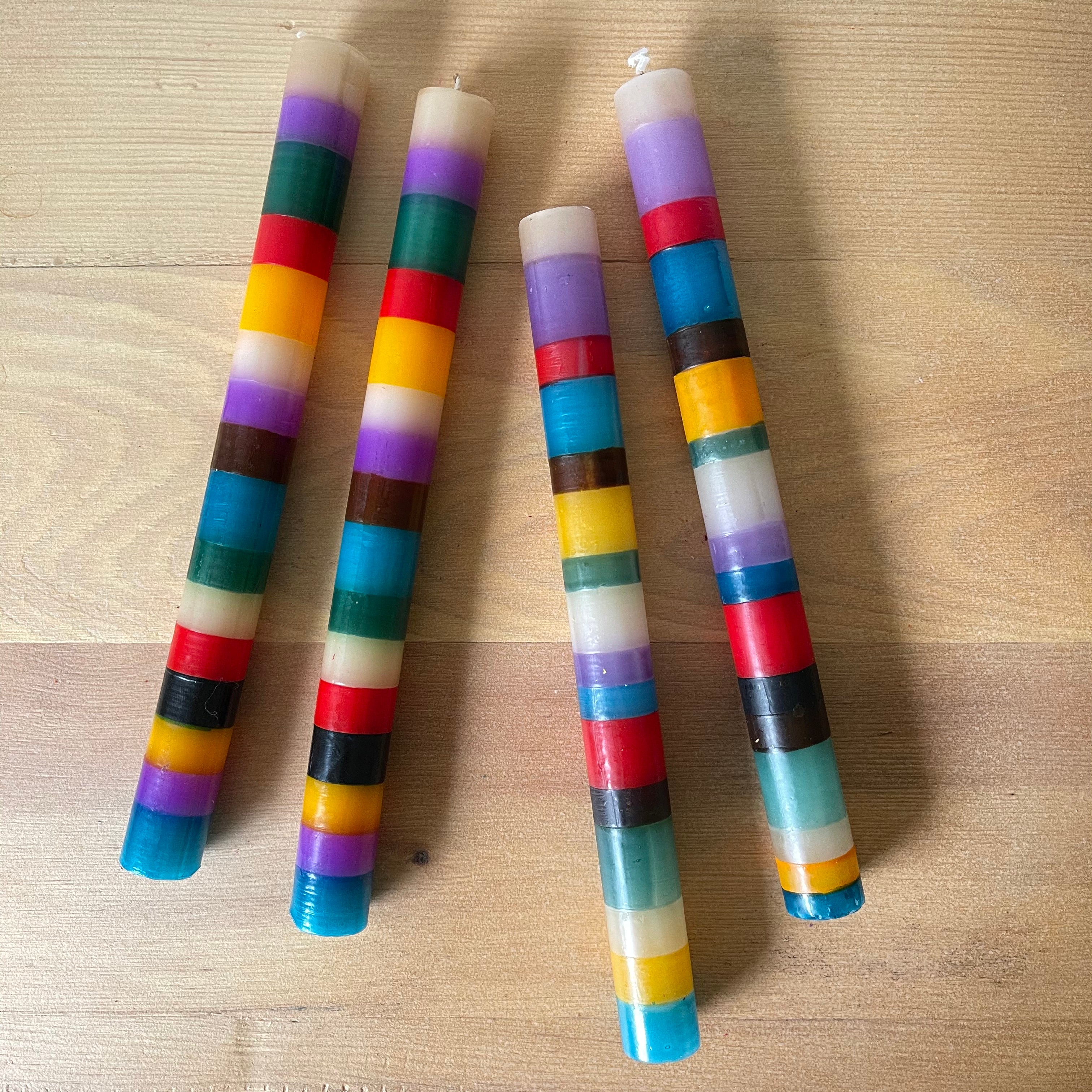 2/ Memphis Stripe taper candle pairs.  Painted in stripes of purples, green, red, yellow, turquoise and brown. Fair Trade home decor.