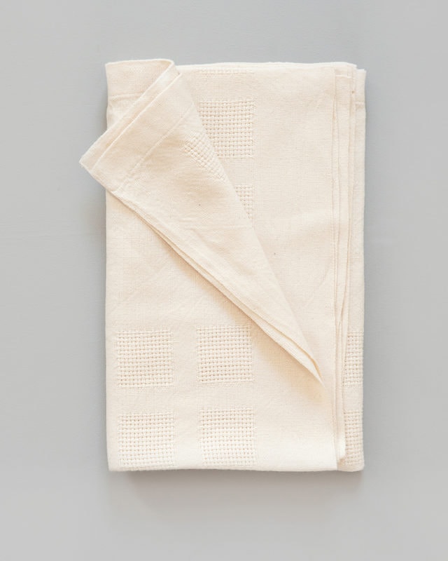 Soft cream color organic cotton baby blanket.