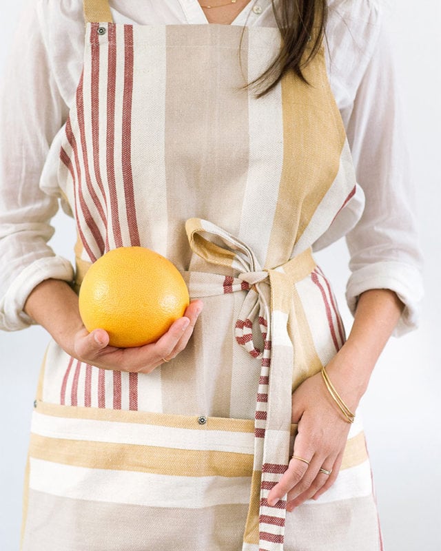 Chef's Apron with variegated stripes of rust/red, cream, and mustard yellow. 