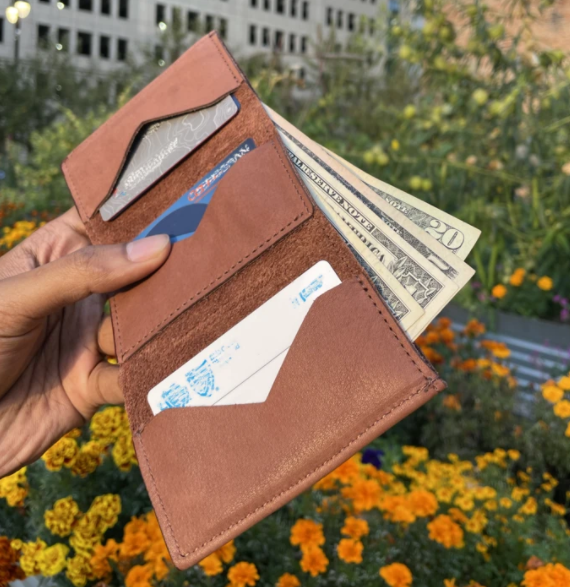 Unfolded, the wallet holds bills and multiple spaces for cards & license. 