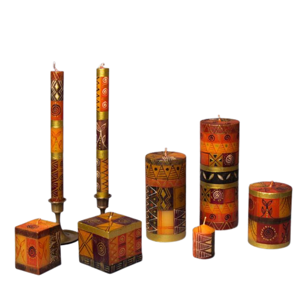 Safari Gold candle collection.  Shades of brown, tan and chocolate with gold touches.  Two cube candles, taper candle pair, three pillar candles, and votive candles.