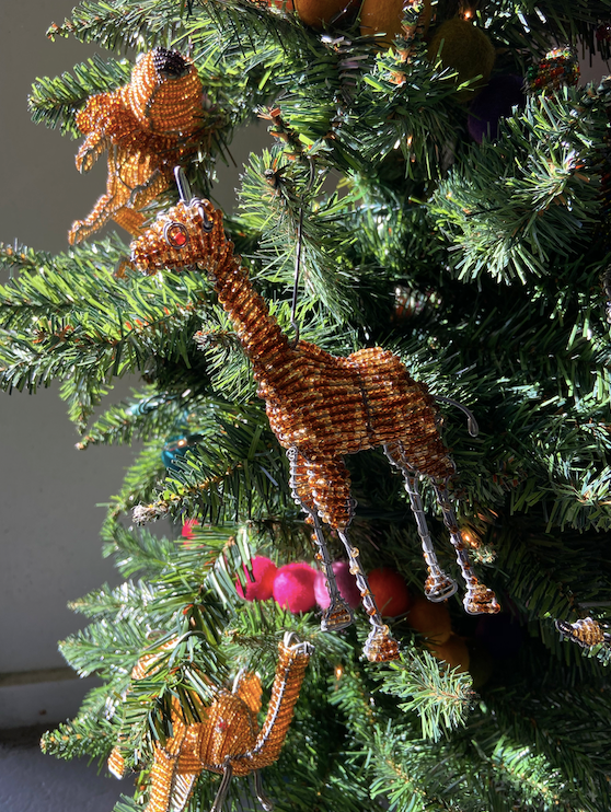 Hand made beaded animals are also fun to use as tree ornaments! Here is a beaded giraffe. Fair Trade products.