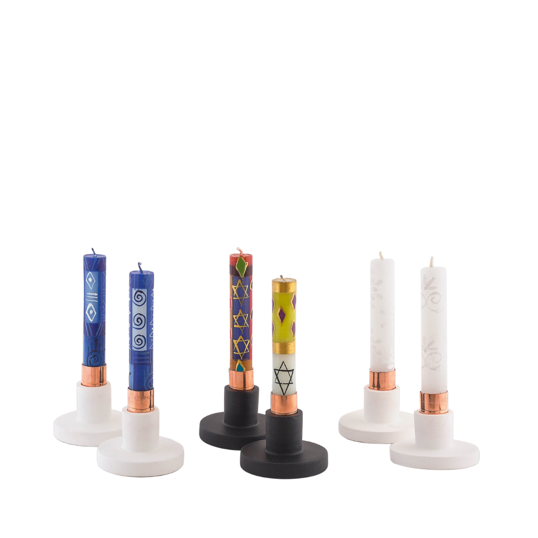 A candle taper pair of Hamsa blue & white shabbat candles, a taper pair of Judaica shabbat candles, and a taper  pair of white on white shabbat candles.  All 4" high, and in candle taper holders. 