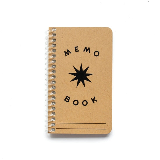 Small memo book with brown cover and words Memo Book in black with a big 'spark' burst in the middle.  